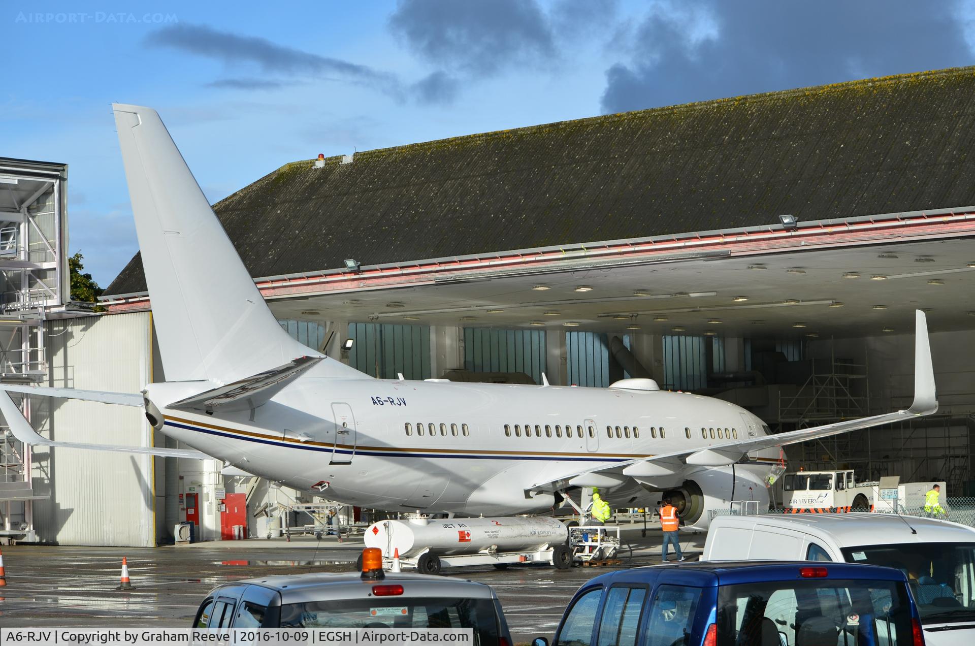 A6-RJV, Boeing 737-77W BBJ C/N 62467/5564, Still partly in the hangar after being re-sprayed.