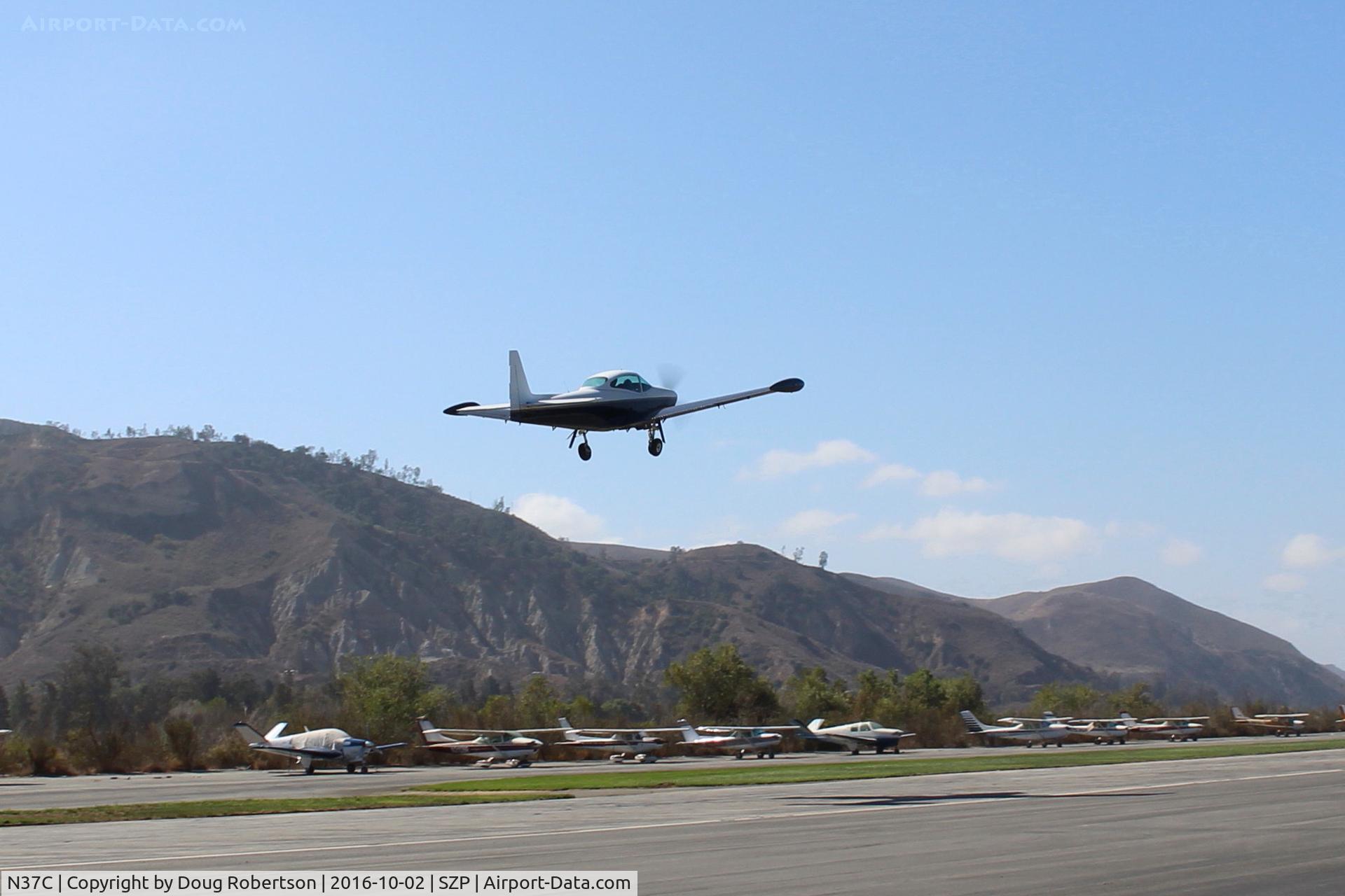 N37C, 1950 Ryan Navion B C/N NAV-4-2184B, 1950 Ryan NAVION B, Continental IO-550 300 Hp upgrade, takeoff climb Rwy 22