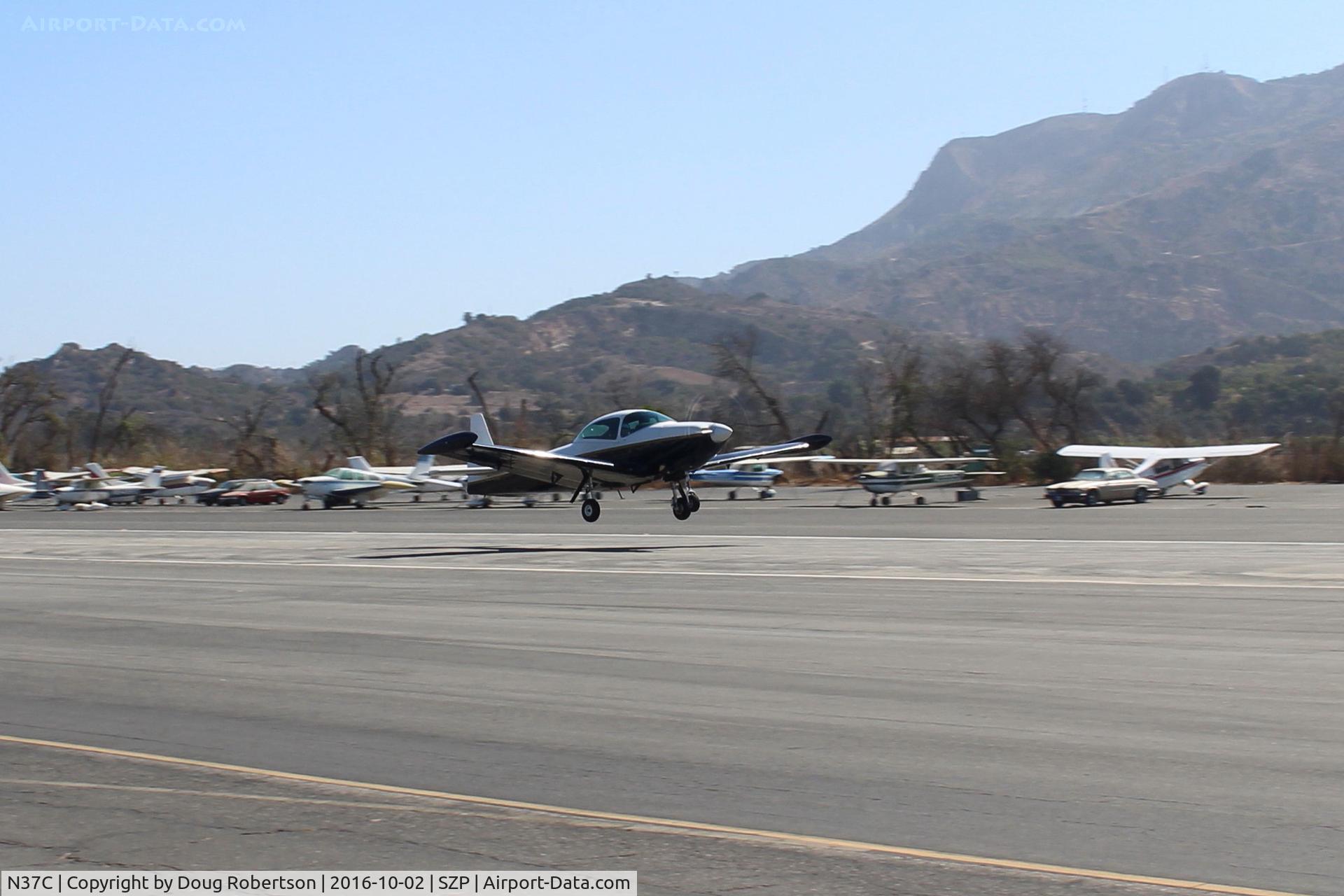 N37C, 1950 Ryan Navion B C/N NAV-4-2184B, 1950 Ryan NAVION B, Continental IO-550 300 Hp upgrade, takeoff climb Rwy 22