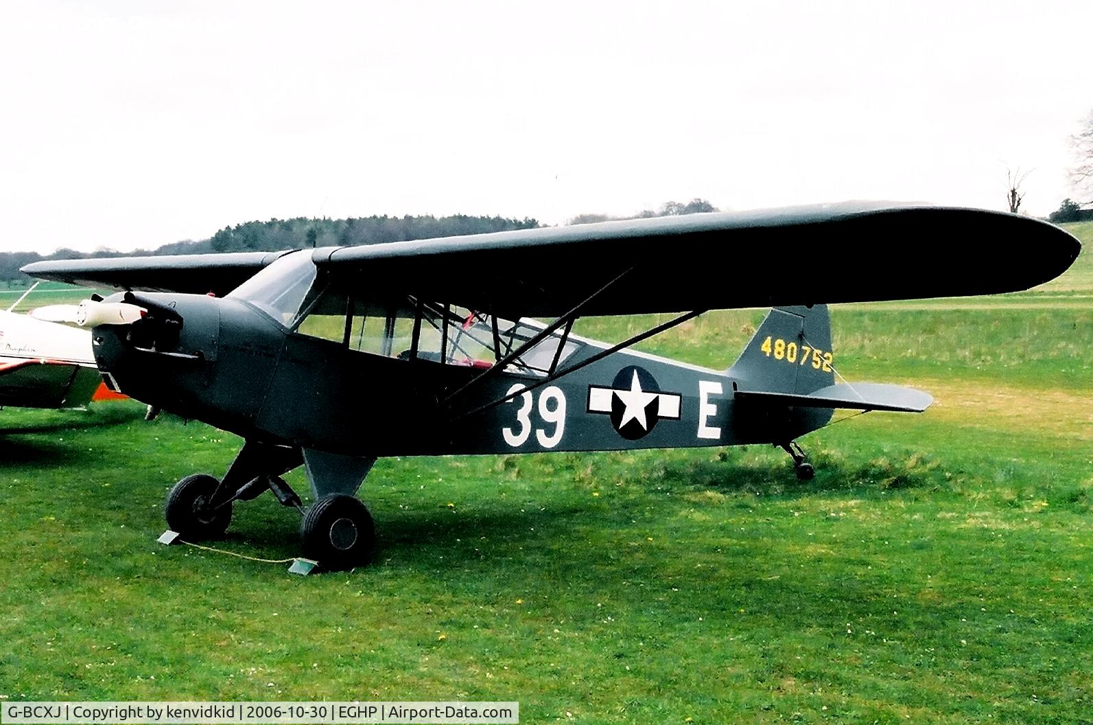 G-BCXJ, 1944 Piper L-4J Grasshopper (J3C-65D) C/N 13048, At a Popham fly-in circa 2006.