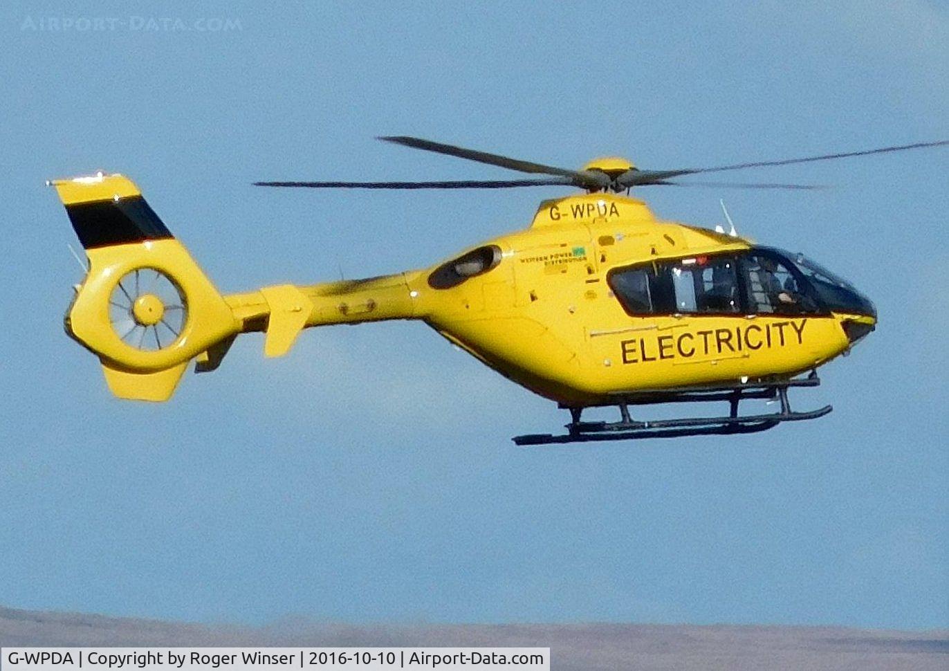 G-WPDA, 1999 Eurocopter EC-135P-1 C/N 0109, Off airport. Western Power Distribution Helicopter Unit helicopter inspecting power lines near Swansea, Wales, UK.