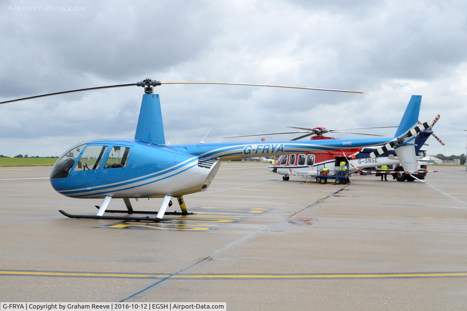 G-FRYA, 2006 Robinson R44 Raven II C/N 11605, Parked at Norwich.