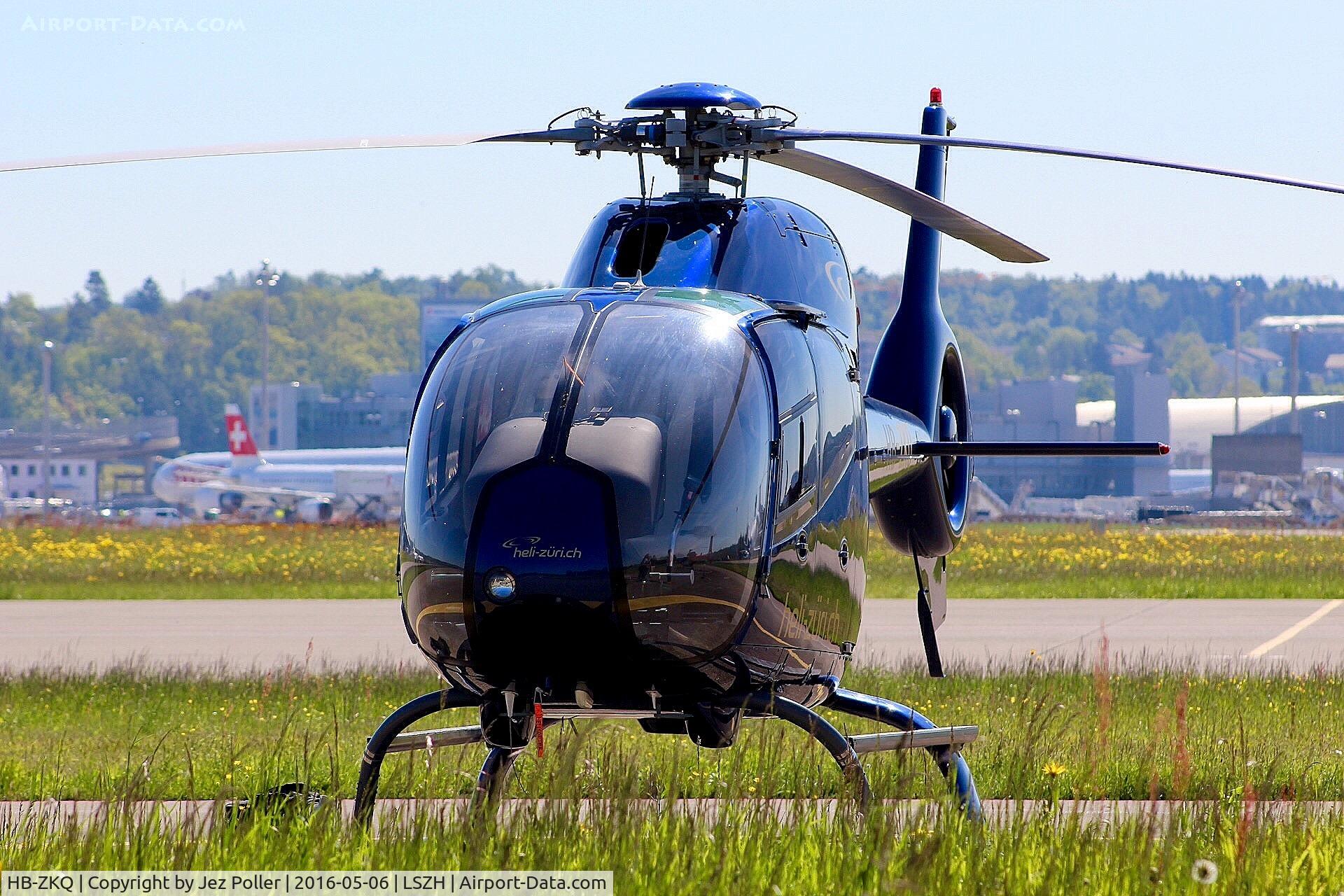 HB-ZKQ, 2002 Eurocopter EC-120B Colibri C/N 1316, operated by Helisitterdorf and Heli-Zuri as a business charter aviation service and is seen out in Swiss afternoon sunshine awaiting next sortie,