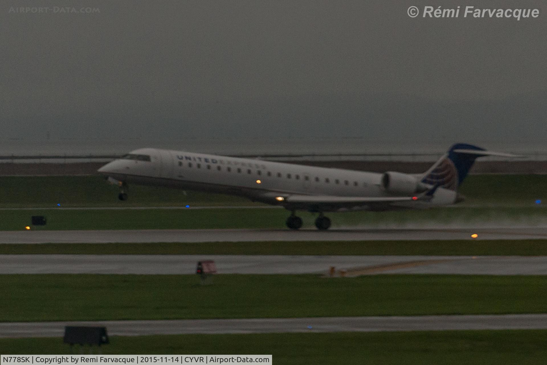 N778SK, 2006 Bombardier CRJ-700 (CL-600-2C10) Regional Jet C/N 10242, Starting takeoff rotation, easterly on south runway.