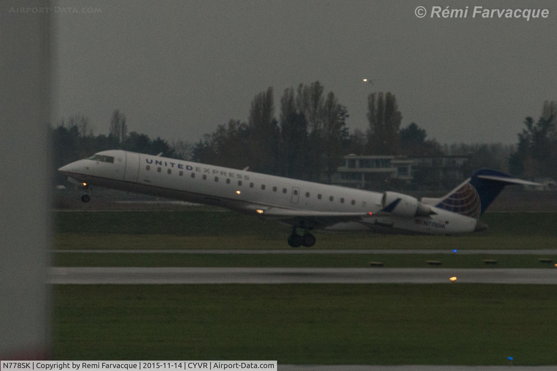 N778SK, 2006 Bombardier CRJ-700 (CL-600-2C10) Regional Jet C/N 10242, Easterly takeoff on south runway.