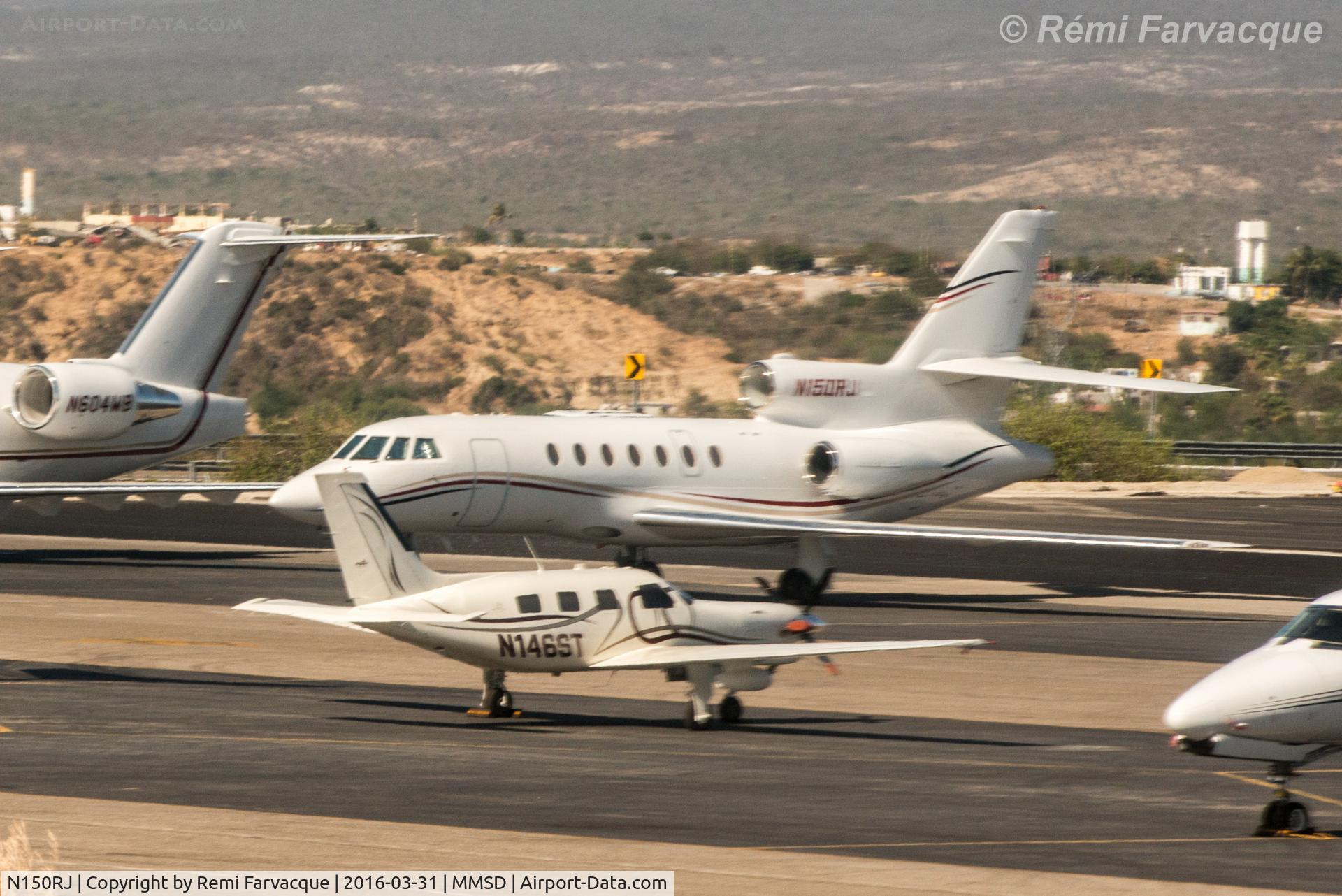 N150RJ, 2002 Dassault Mystere Falcon 50 C/N 324, Parked in executive jet area. Blurry due to photo taken from another craft.