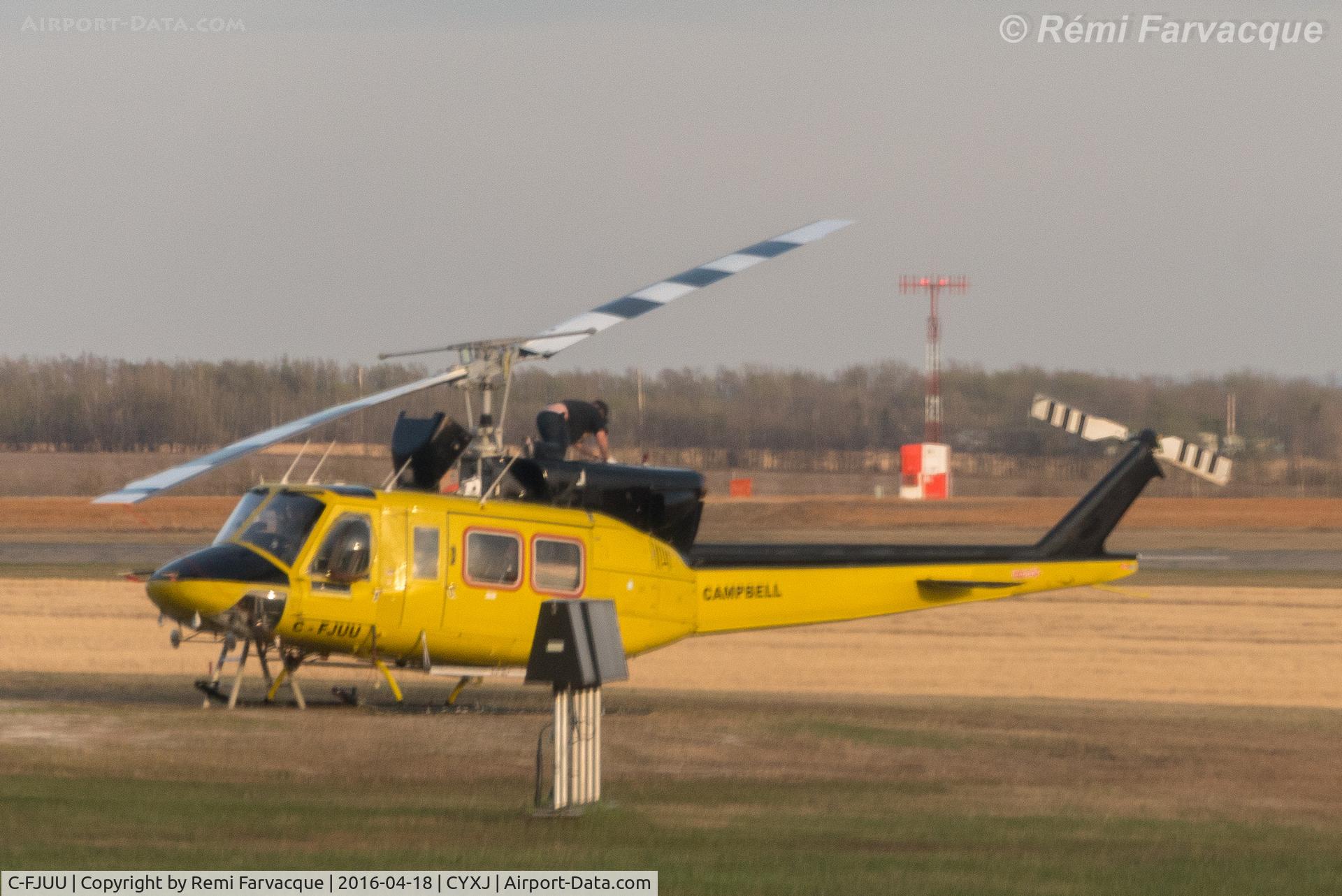 C-FJUU, 1976 Bell 212 C/N 30795, Maintenance in progress. Parked opposite main terminal.
