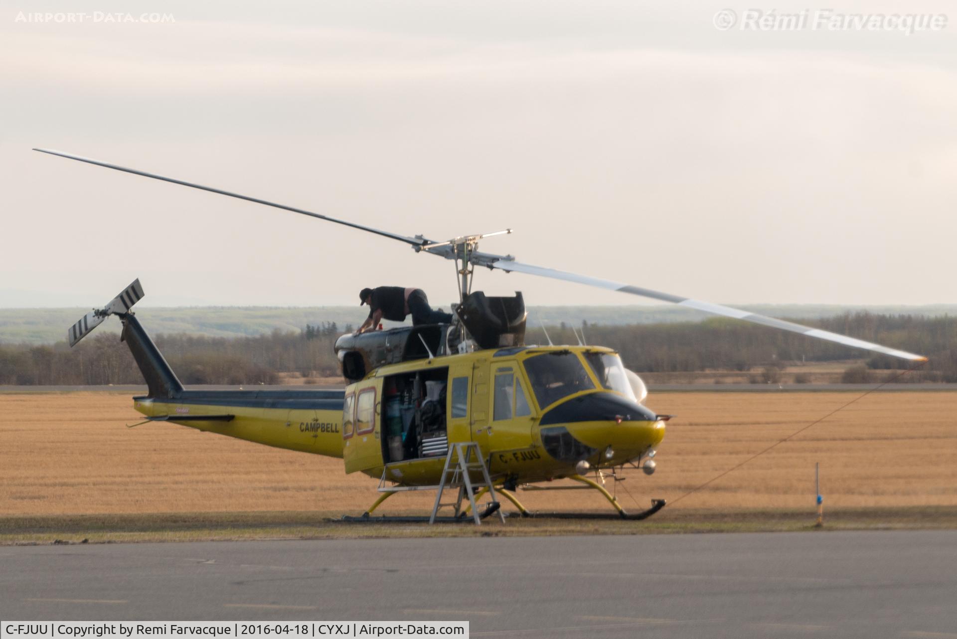 C-FJUU, 1976 Bell 212 C/N 30795, Maintenance in progress. Parked opposite main terminal.