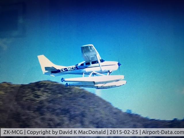 ZK-MCG, Cessna U206G Stationair C/N U20603551, We were cruising up the east coast of the Abel Tasman National Park on February 25, 2015.  ZK MCG took off right past our boat.  I video taped it and took a screen shot of closest the aircraft was to us.