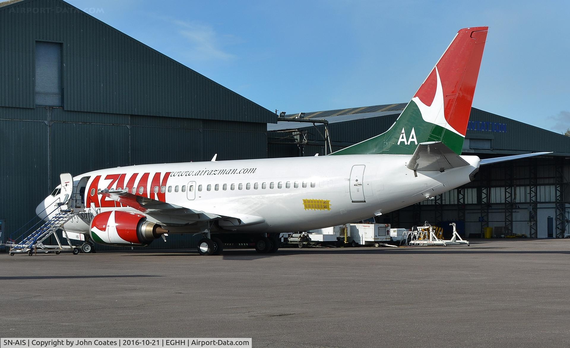 5N-AIS, 1998 Boeing 737-5L9 C/N 29235, New reg 5N-AIS temporarily covered IS showing on nosewheel