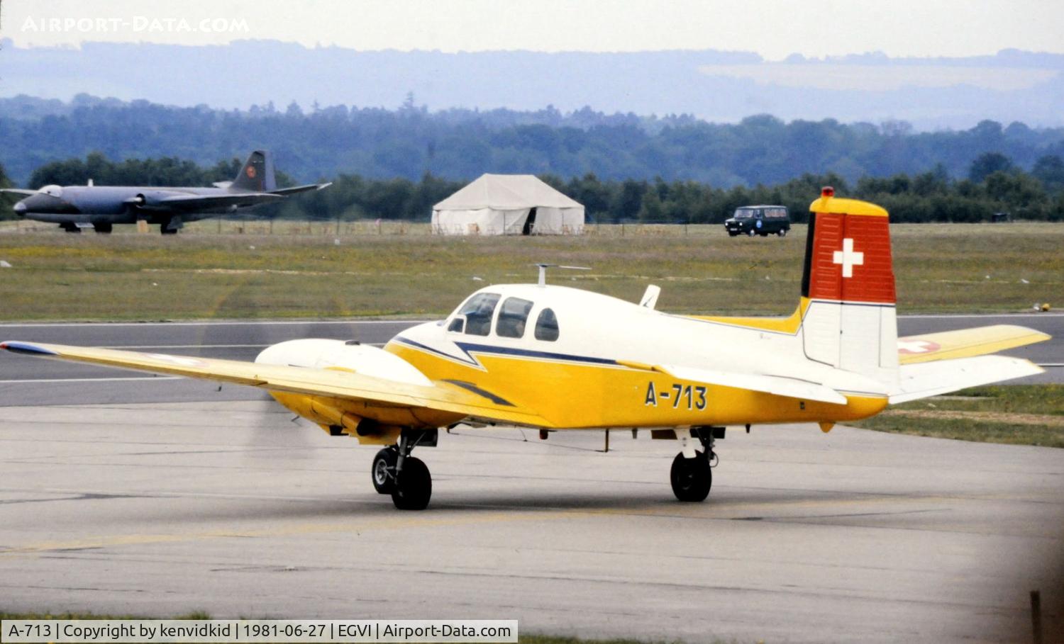A-713, 1957 Beech E50 Twin Bonanza C/N EH-58, At the 1981 International Air Tattoo, scanned from slide.