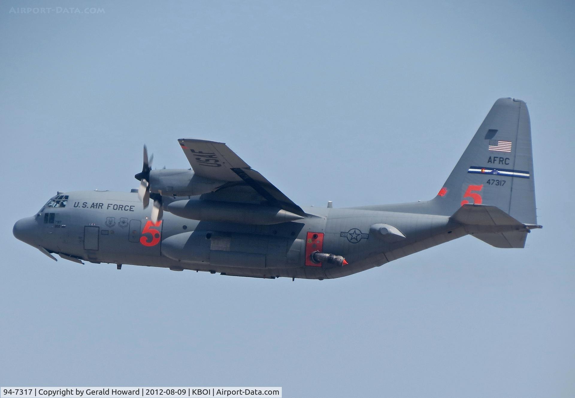 94-7317, 1994 Lockheed C-130H Hercules C/N 382-5391, 302nd Air Wing, Peterson AFB, CO departing RWY 10L. Equipped with MAFFS for water drops.