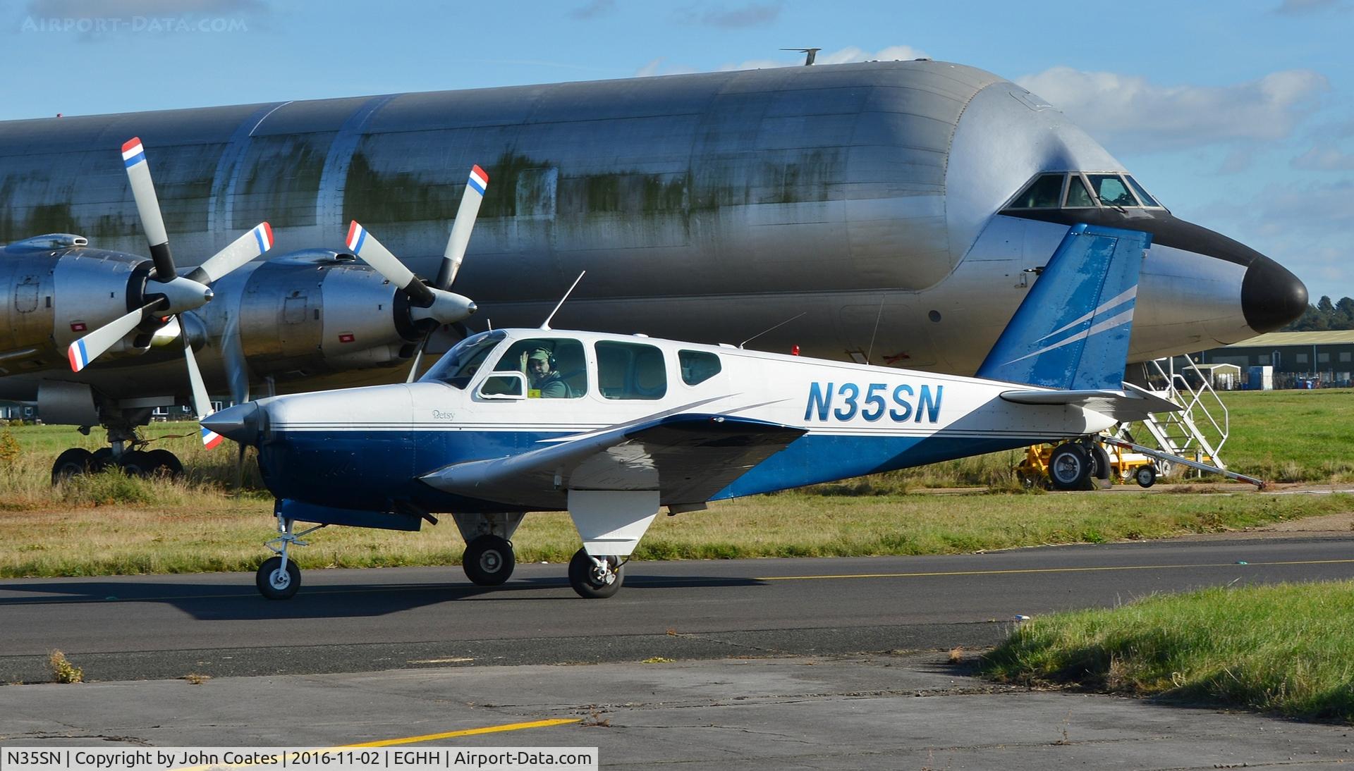 N35SN, 1960 Beech 35-33 Debonair C/N CD-207, Taxiing past the deteriorating guppy