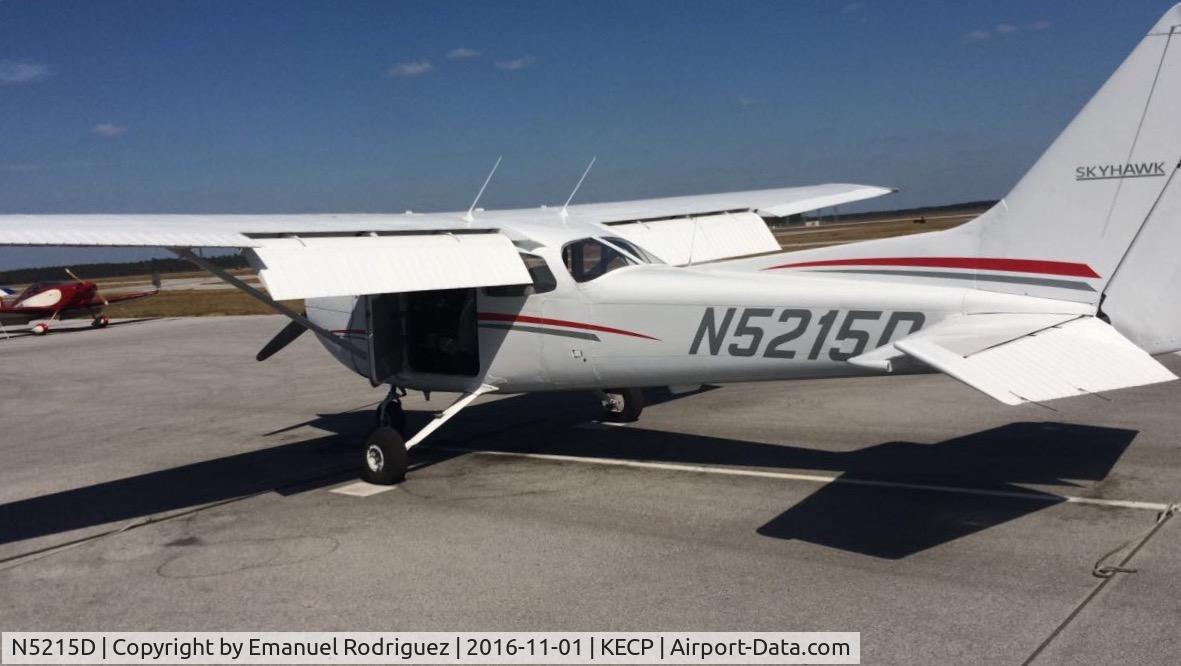 N5215D, 1979 Cessna 172N C/N 17272453, Preflight with flaps down and doors open. Tie downs off and chocks removed.