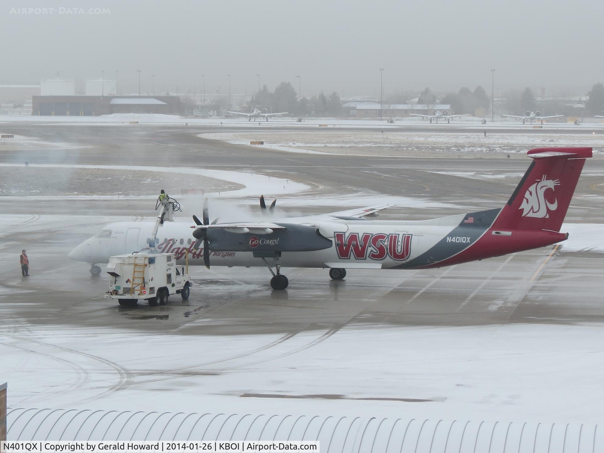 N401QX, 2001 De Havilland Canada DHC-8-402 Dash 8 C/N 4031, De Ice before departure.