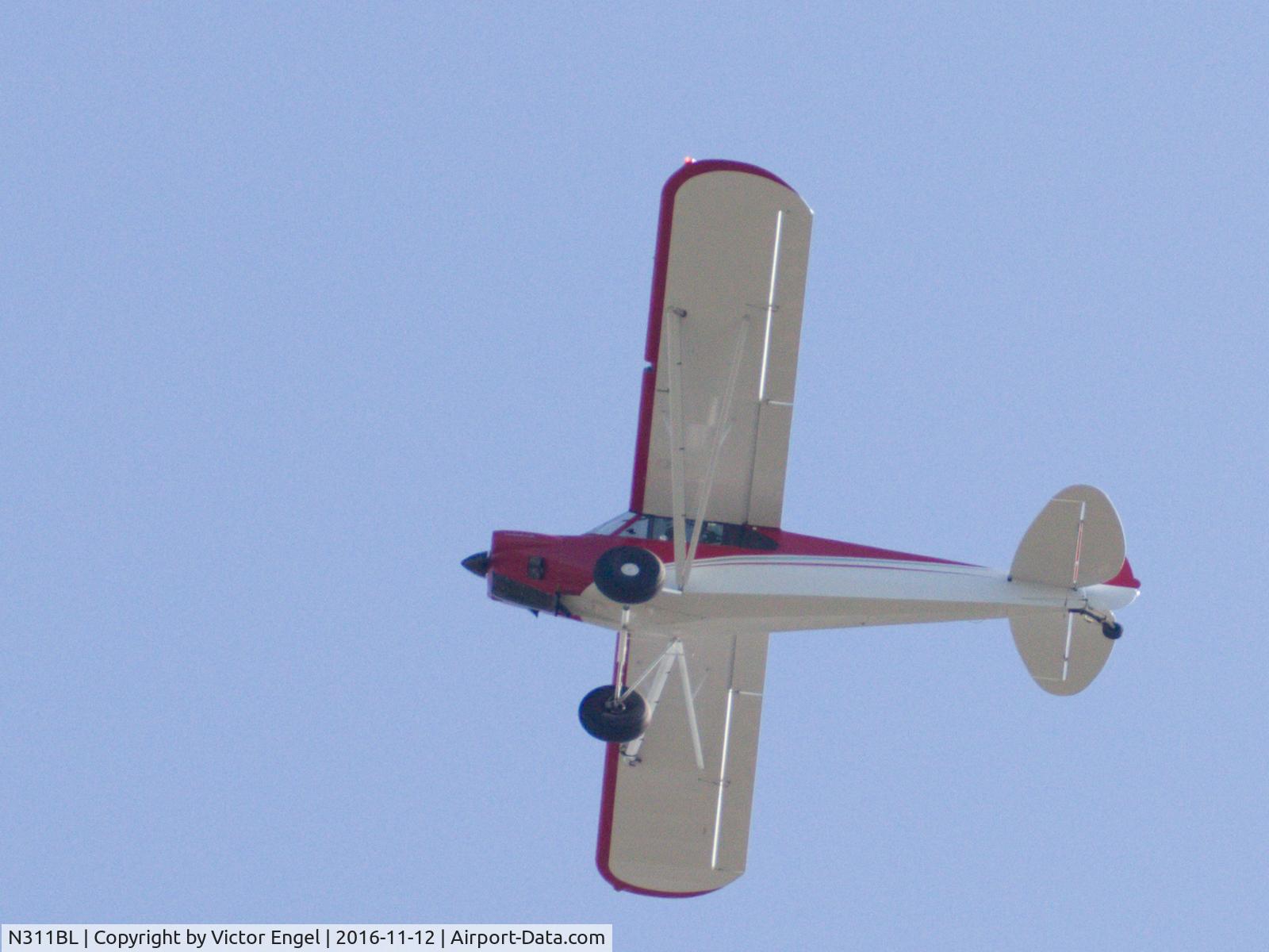N311BL, Cub Crafters CC11-160 Carbon Cub SS C/N CC11-00141, Flying over my position in 78757 zip code. No tail number visible on plane.