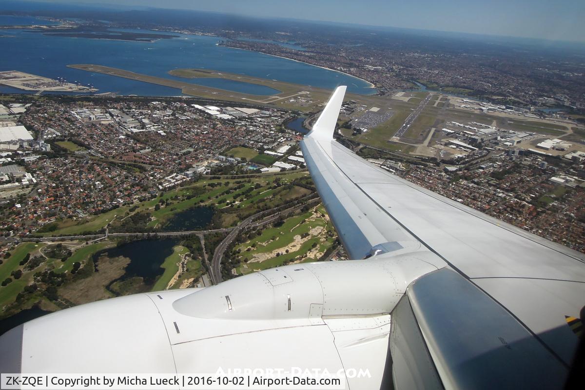ZK-ZQE, 2011 Boeing 737-838 C/N 34185, Climbing out of Sydney, passing the airport we just took off from, and on our way to Auckland