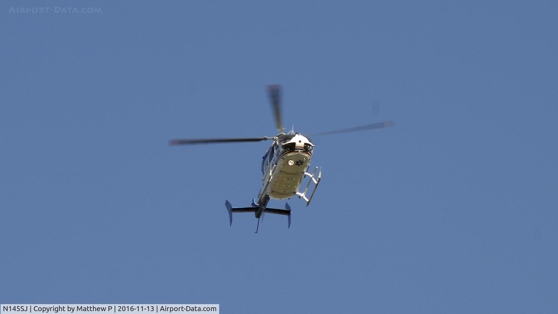 N145SJ, Eurocopter-Kawasaki EC-145 (BK-117C-2) C/N 9091, N145SJ Owned by Mercy Air Speeds by in a rush headed towards KCNO Chino Airport