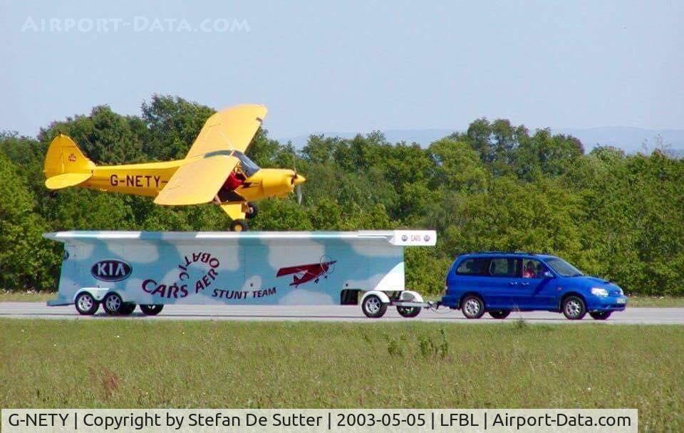 G-NETY, 1994 Piper PA-18-150 Super Cub C/N 1809108, Display flown by Martyn Carrington in Limoges on 5 May 2003. Martyn is one of the pilots of the Breitling Wingwalkers. Photo taken by Helen Tempest or Tanya Gaze (wing walkers) on Vic Norman's camera.