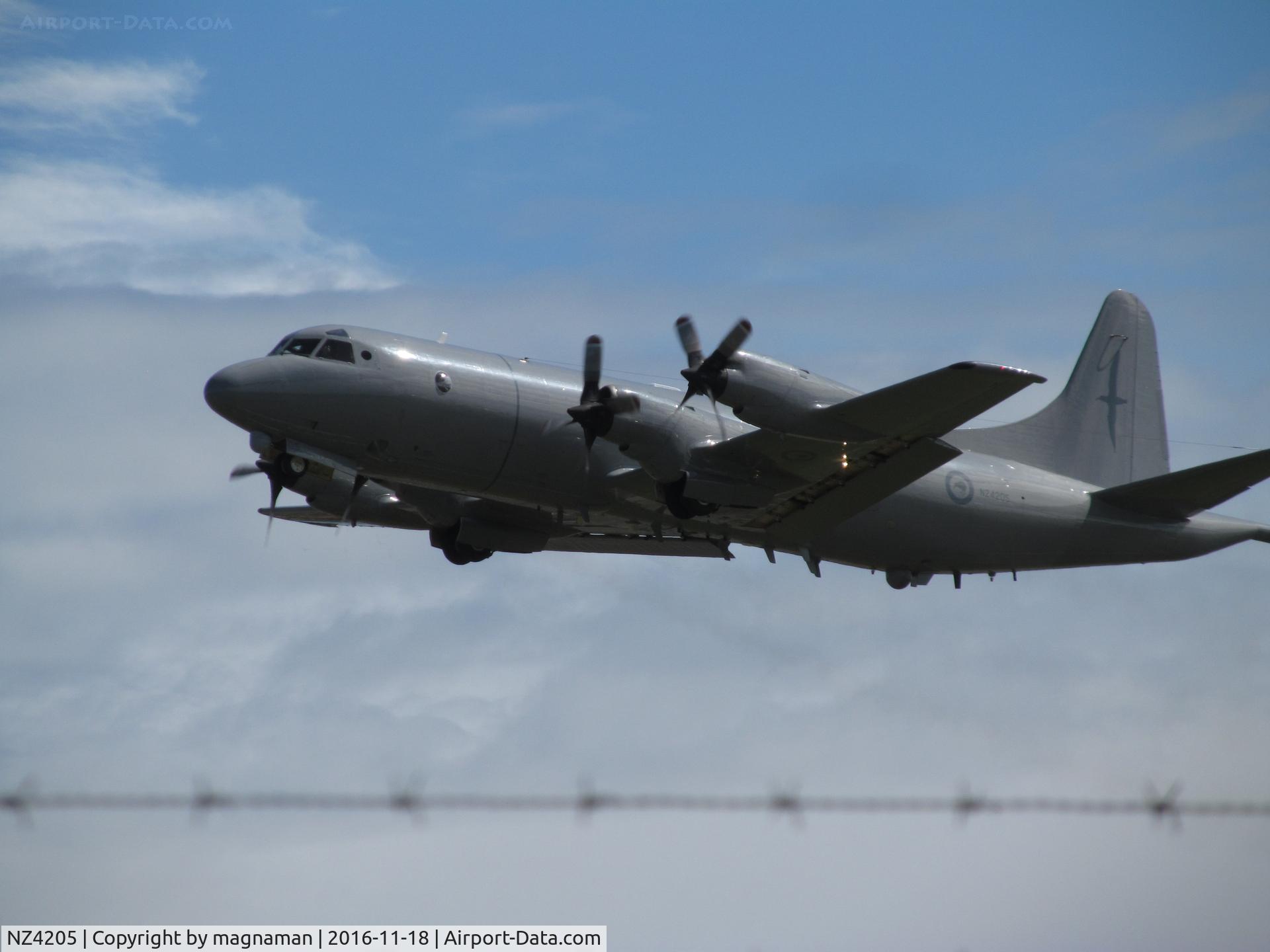 NZ4205, 1966 Lockheed P-3K2 Orion C/N 185-5208, just cleared the fence!