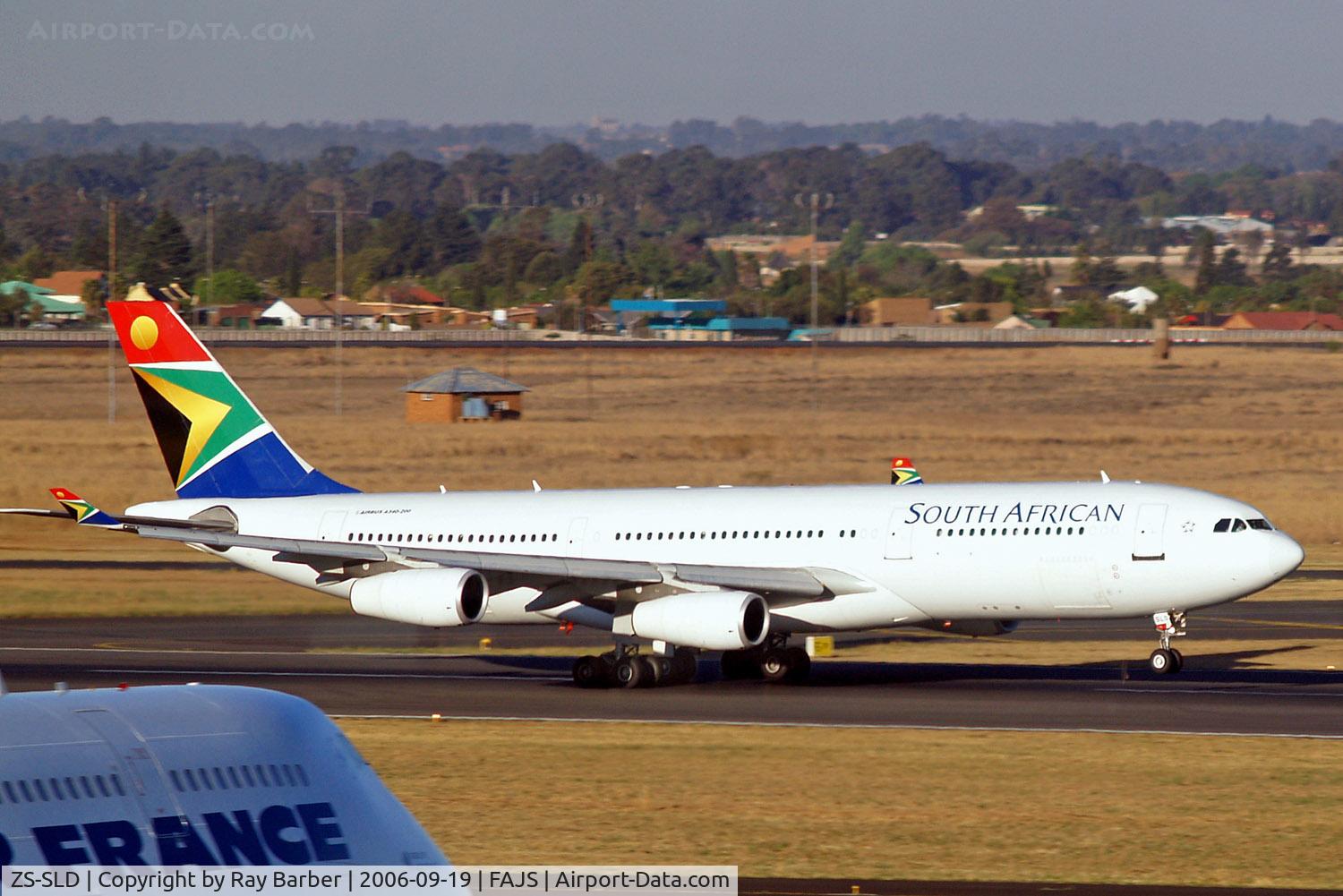 ZS-SLD, 1993 Airbus A340-211 C/N 019, Airbus A340-212 [019] (South African Airways) Johannesburg Int~ZS 19/09/2006. Taken through the glass of the terminal.