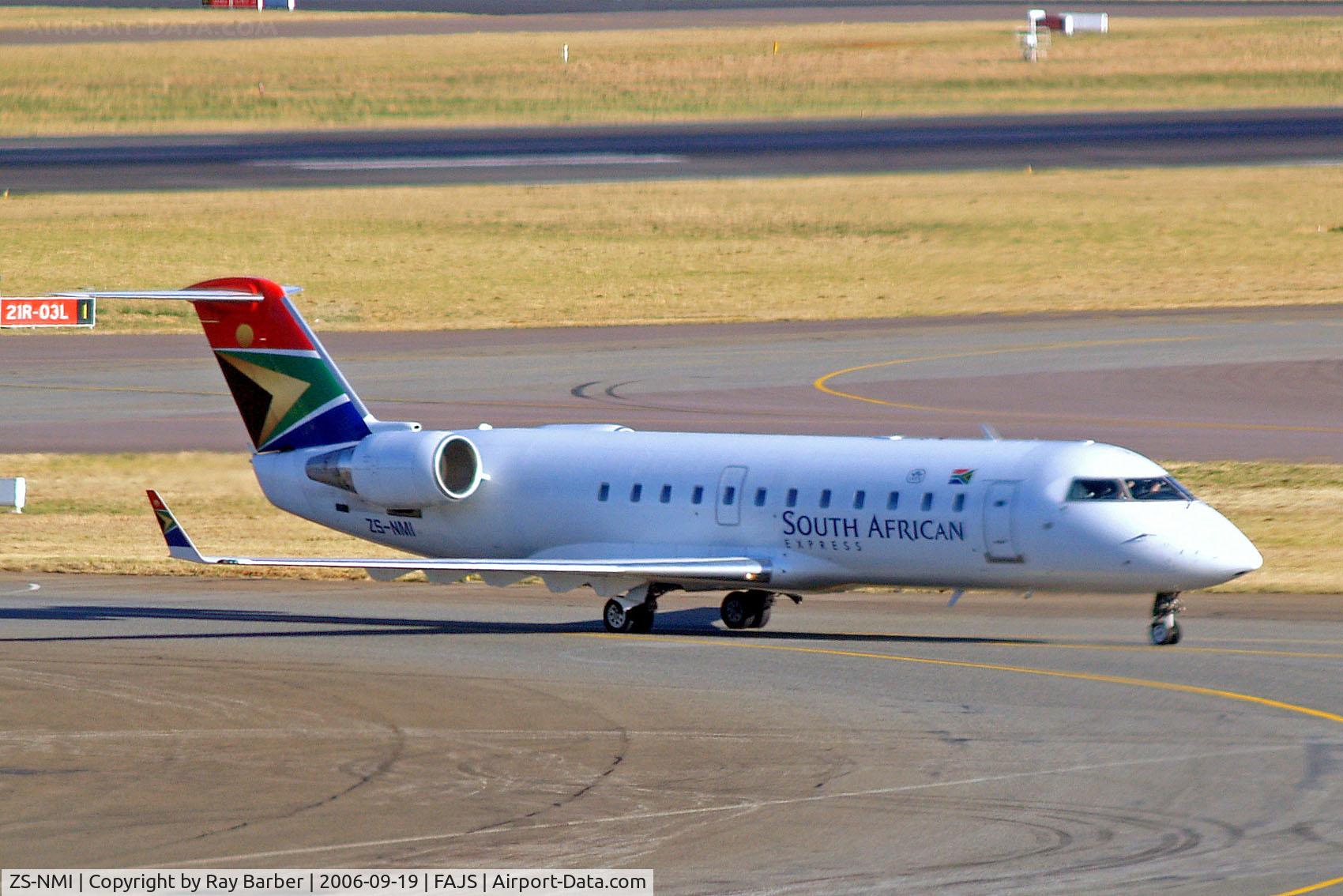 ZS-NMI, 1997 Canadair CRJ-200ER (CL-600-2B19) C/N 7153, Canadair CRJ-200ER [7153] (South African Express) Johannesburg Int~ZS 19/09/2006. Taken through the glass of the terminal.