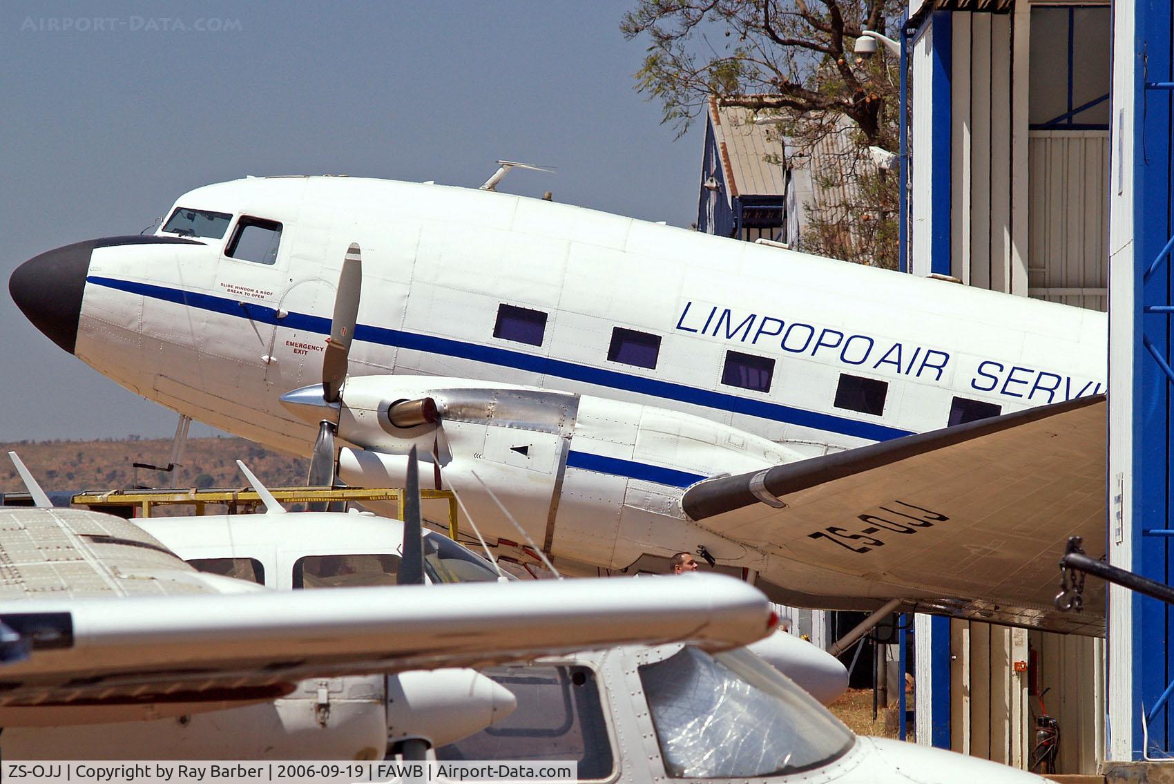 ZS-OJJ, 1944 Douglas DC-3C-TP C/N 16213/32961, Douglas DC-3C-47B-30-DK C-47TP Conversion [16213/32961] (Limpopo Air Services) Pretoria-Wonderboom~ZS 19/09/2006. Seen here with its nose sticking out of a small hangar.
