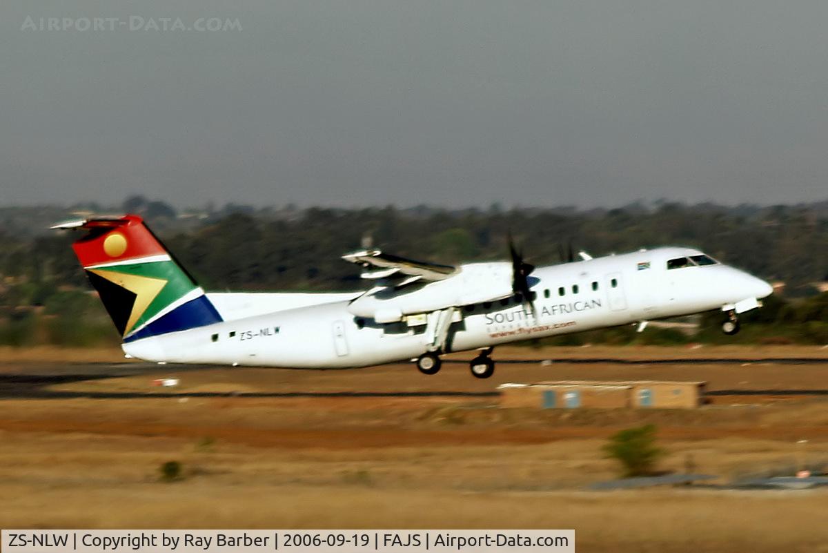 ZS-NLW, 1992 De Havilland Canada DHC-8-300 Dash 8 C/N 338, De Havilland Canada DHC-8-311 Dash 8 [338] (South African Express) Johannesburg Int~ZS 22/09/2006.  Taken through the glass of the terminal.