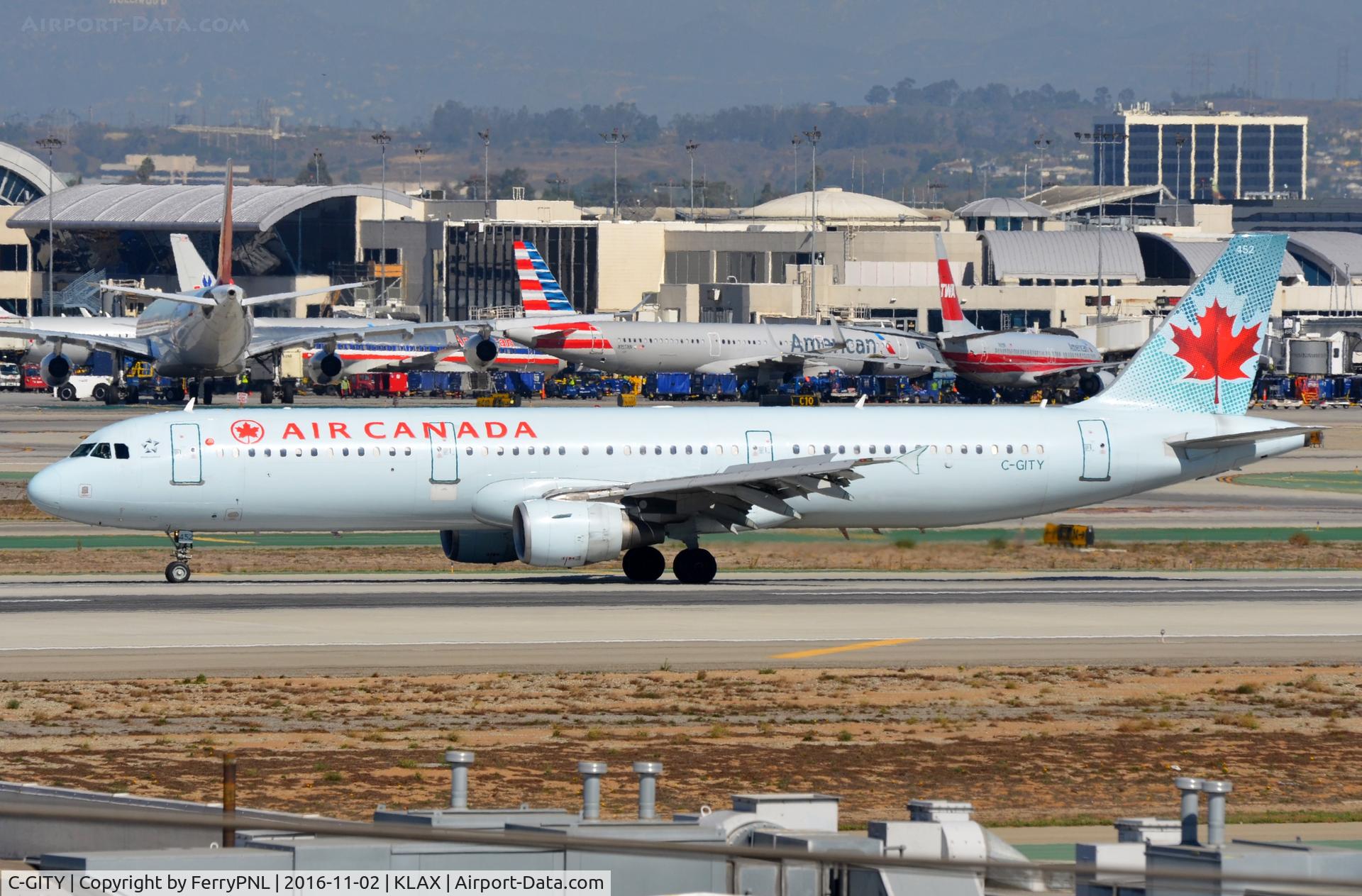 C-GITY, 2001 Airbus A321-211 C/N 1611, Air Canada A321 vacating the runway.