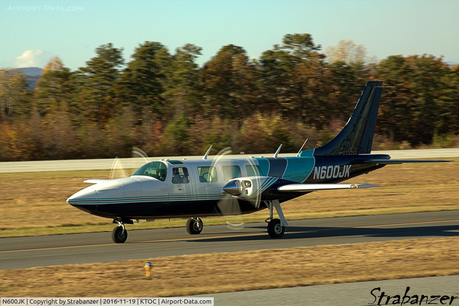 N600JK, 1975 Smith Aerostar 600 C/N 60-0257-104, Taxiing in from a landing on rwy 03 after gusty weather had caused a go-around from rwy 27