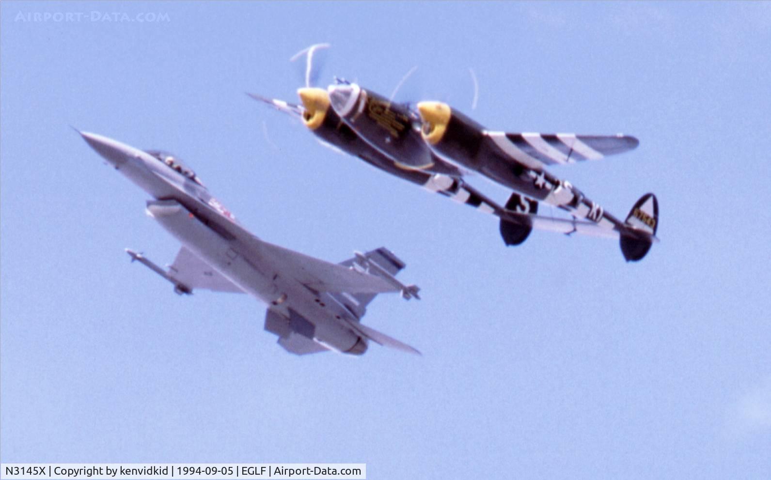 N3145X, 1943 Lockheed P-38J Lightning C/N 2054, At the 1994 Farnborough International Air Show. Scanned from slide.