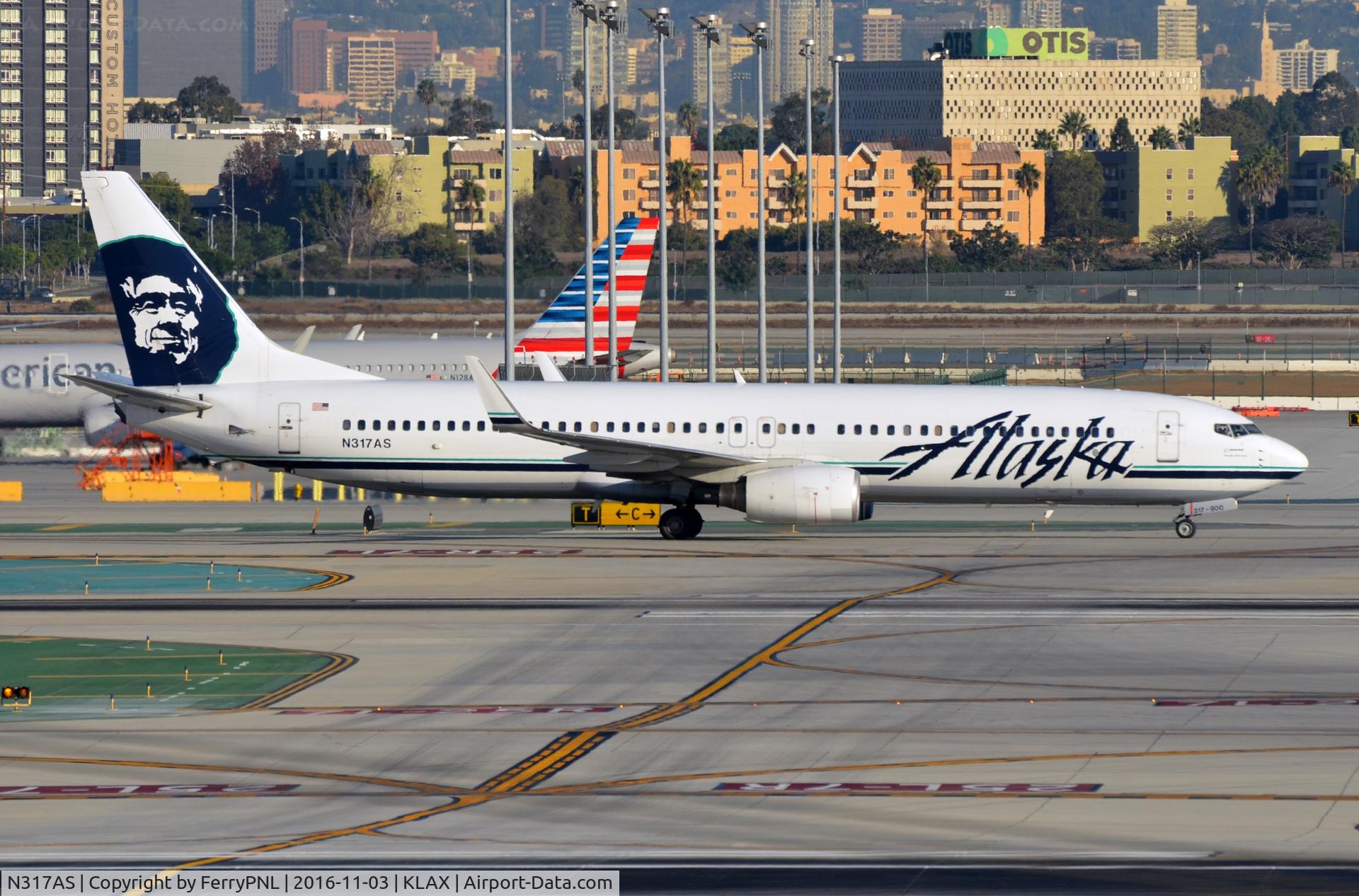 N317AS, 2003 Boeing 737-990 C/N 30856, Alaska B739 taxying to its gate.