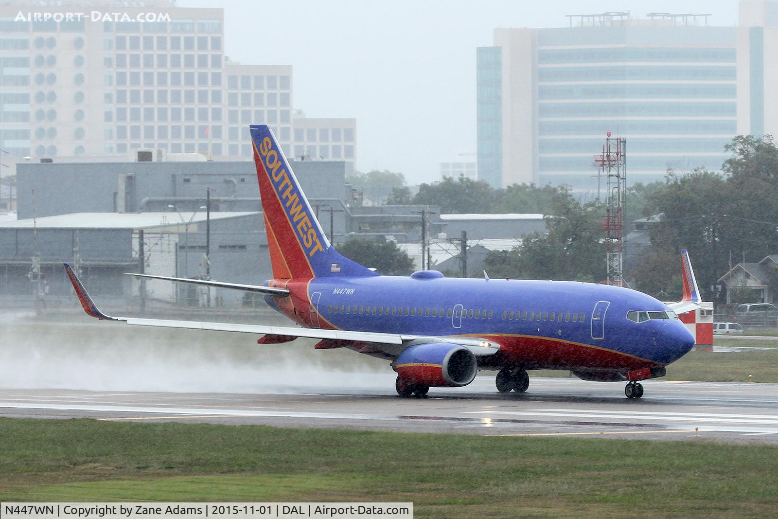N447WN, 2003 Boeing 737-7H4 C/N 33720, Departing Dallas Love Field in the rain.