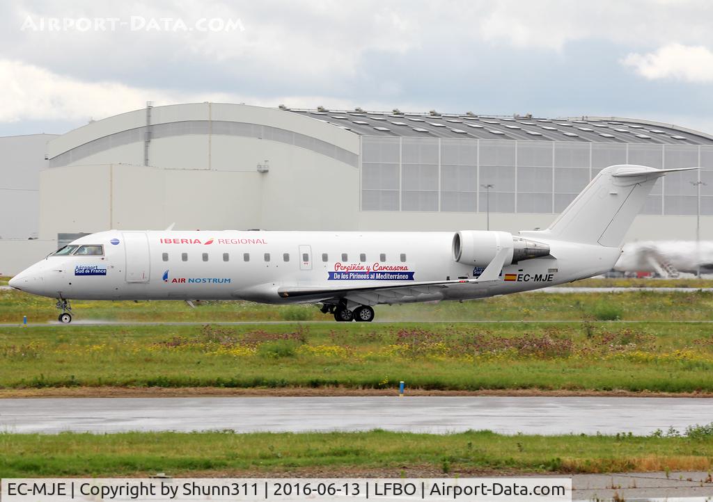 EC-MJE, 2002 Bombardier CRJ-200ER (CL-600-2B19) C/N 7622, Taxiing holding point rwy 32R for departure... additional titles