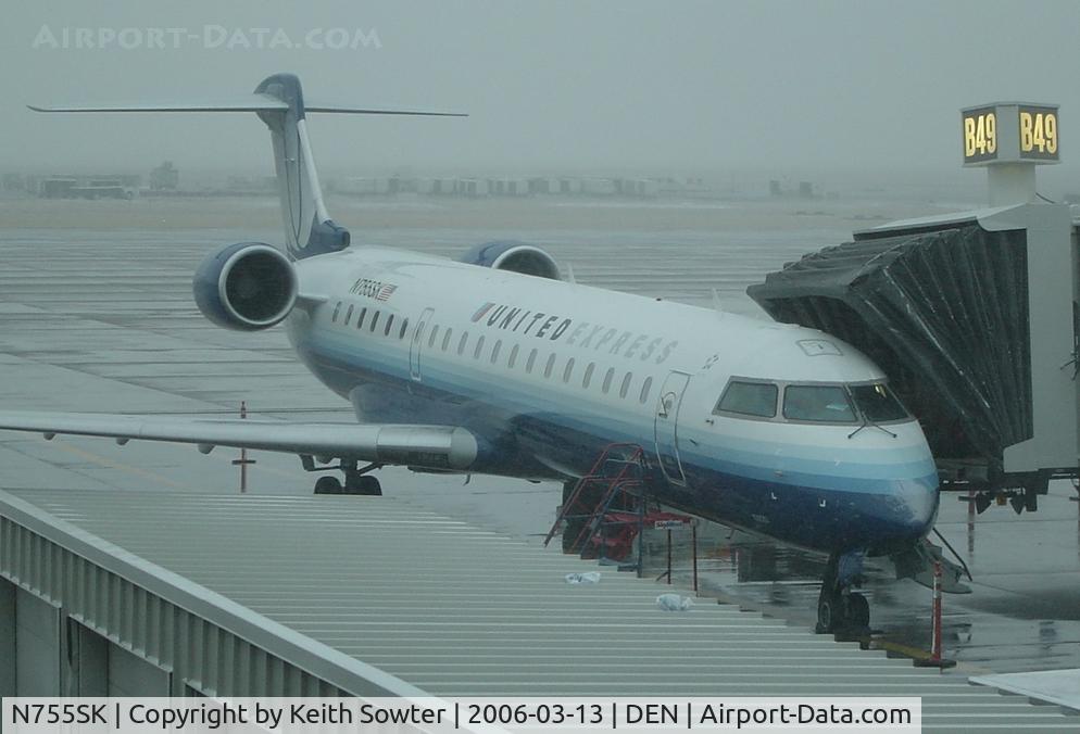 N755SK, 2005 Bombardier CRJ-700 (CL-600-2C10) Regional Jet C/N 10220, Parked on stand at Denver