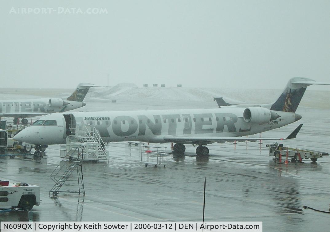 N609QX, 2001 Bombardier CRJ-701 (CL-600-2C10) Regional Jet C/N 10031, Parked on stand at Denver