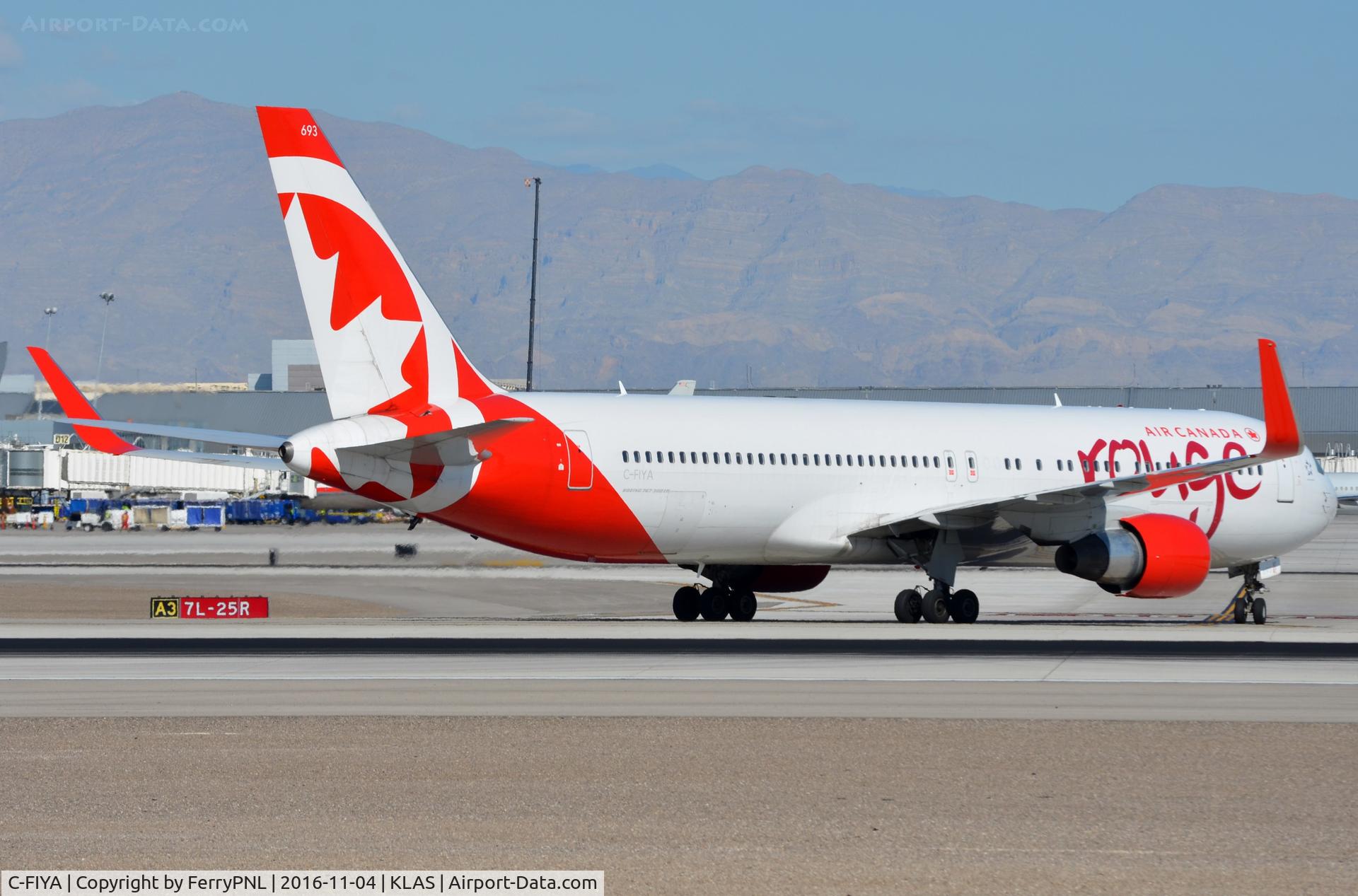 C-FIYA, 2002 Boeing 767-33A C/N 33421, Rouge B763 about to cross the runway.