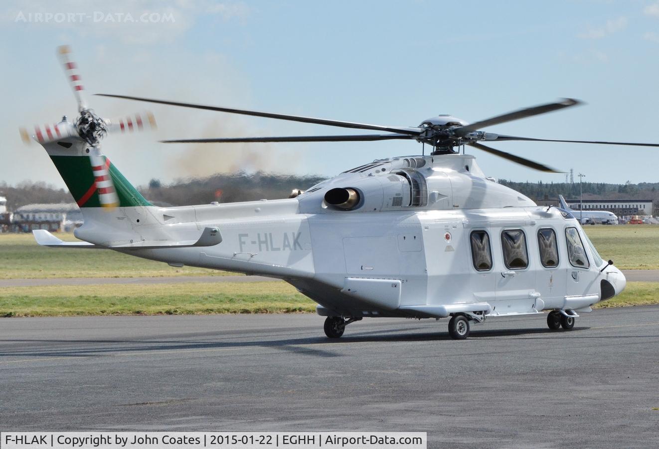 F-HLAK, 2010 AgustaWestland AW-139 C/N 31269, Departing Signature with fire on St Catherines Hill behind