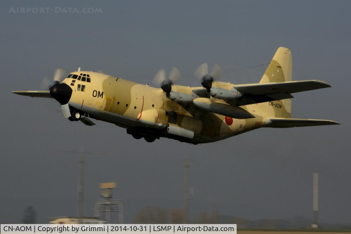 CN-AOM, 1980 Lockheed C-130H Hercules C/N 382-4875, Desert Beauty leaving Payerne in the early afternoon, the sun just eliminating the last bit of fog. The transport fleet was supporting the national disaster relief organisation for an exercise near Geneva.