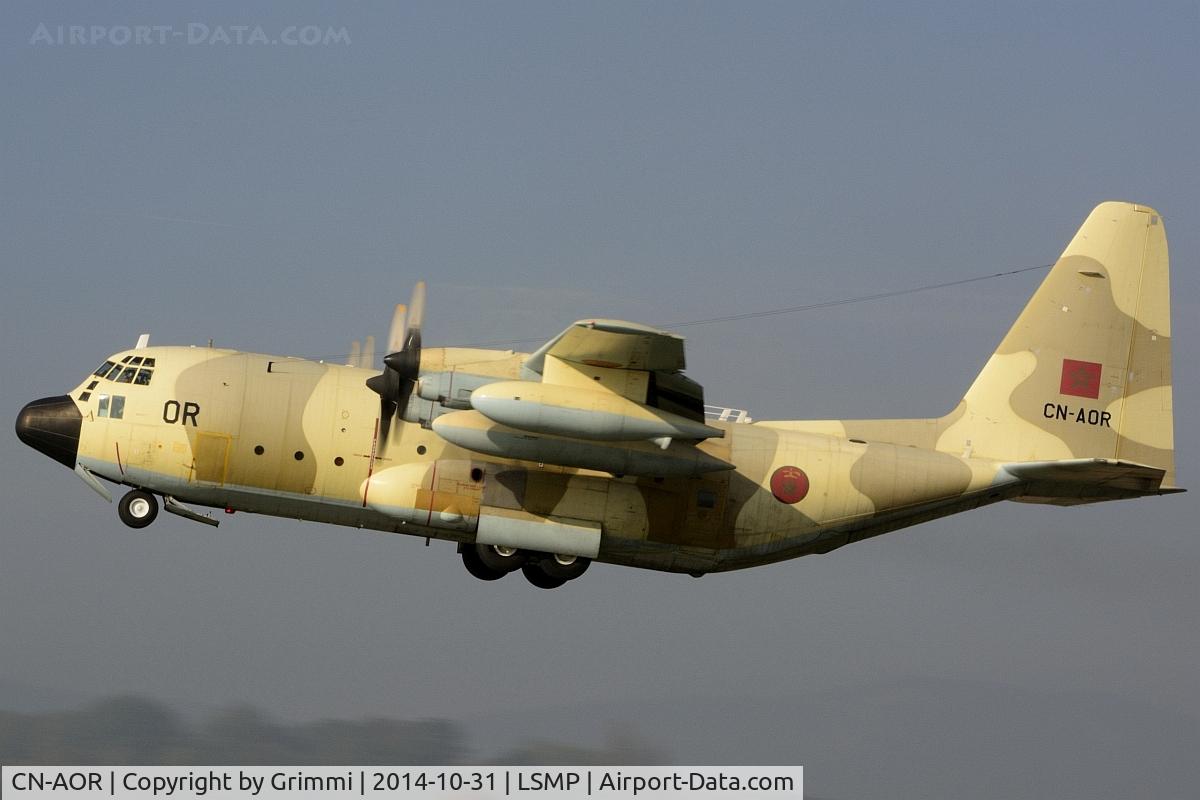 CN-AOR, 1981 Lockheed KC-130H Hercules C/N 382-4907, Another desert Beauty leaving Payerne in the early afternoon, the sun just eliminating the last bit of fog. The transport fleet was supporting the national disaster relief organisation for an exercise near Geneva.