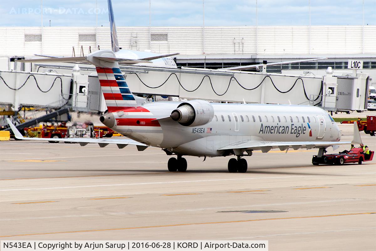 N543EA, 2011 Bombardier CRJ-700 (CL-600-2C10) Regional Jet C/N 10323, Pushback at ORD.