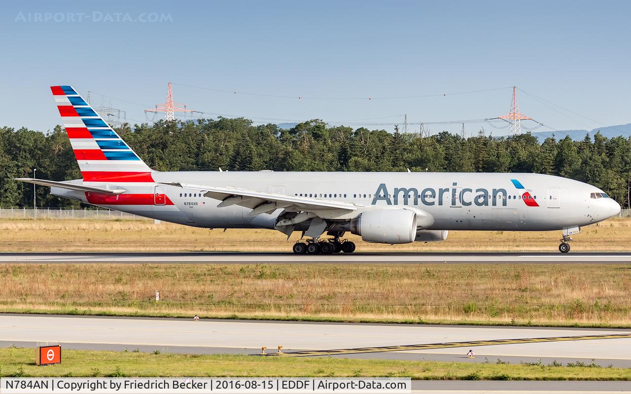 N784AN, 2000 Boeing 777-223 C/N 29588, decelerating after touchdown on runway 07L