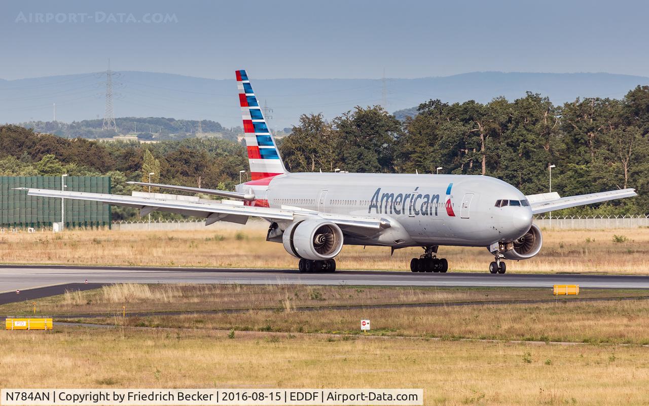 N784AN, 2000 Boeing 777-223 C/N 29588, decelerating after touchdown on runway 07L