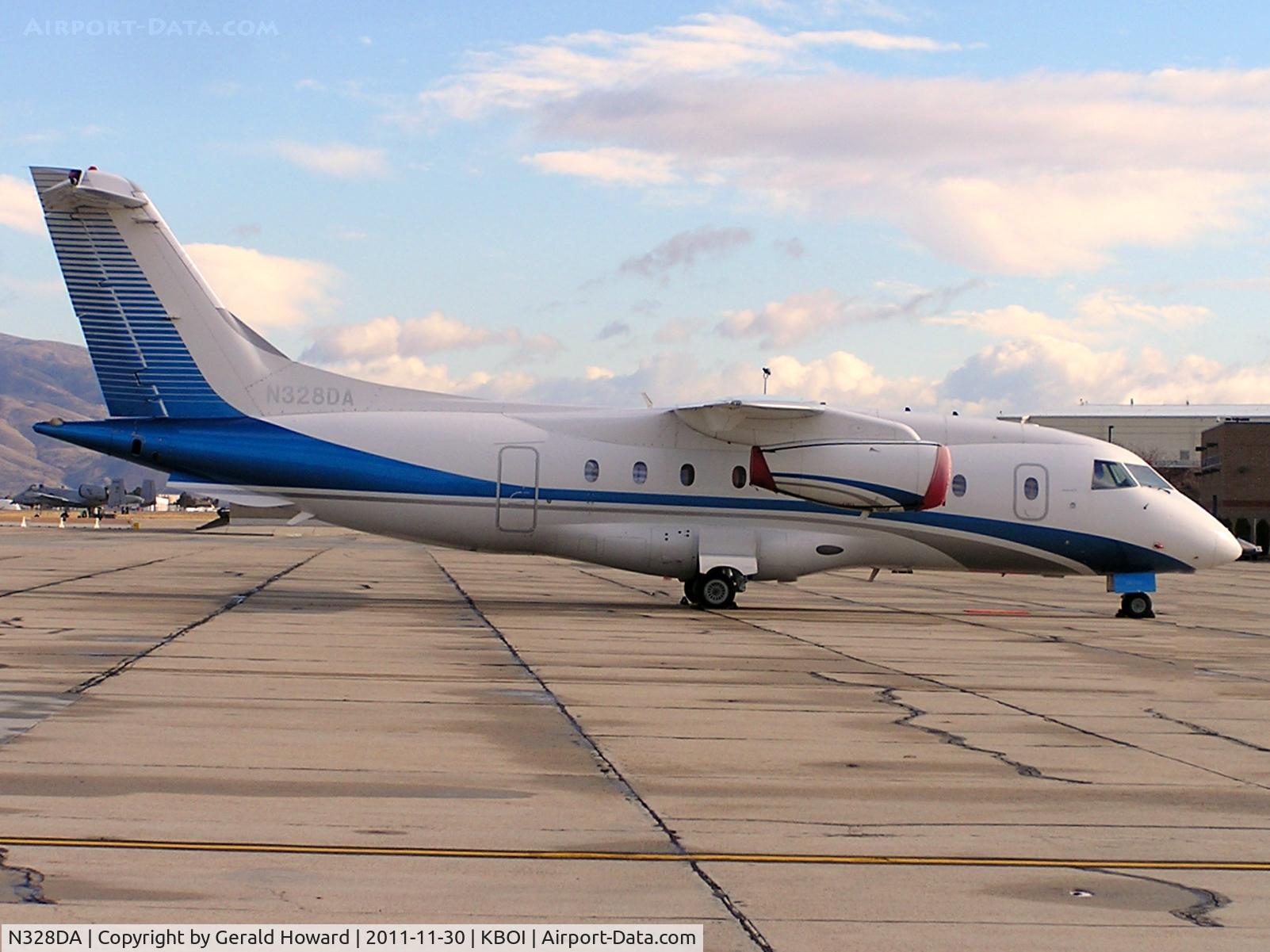 N328DA, 1995 Dornier 328-100 C/N 3023, Parked on western ramp/