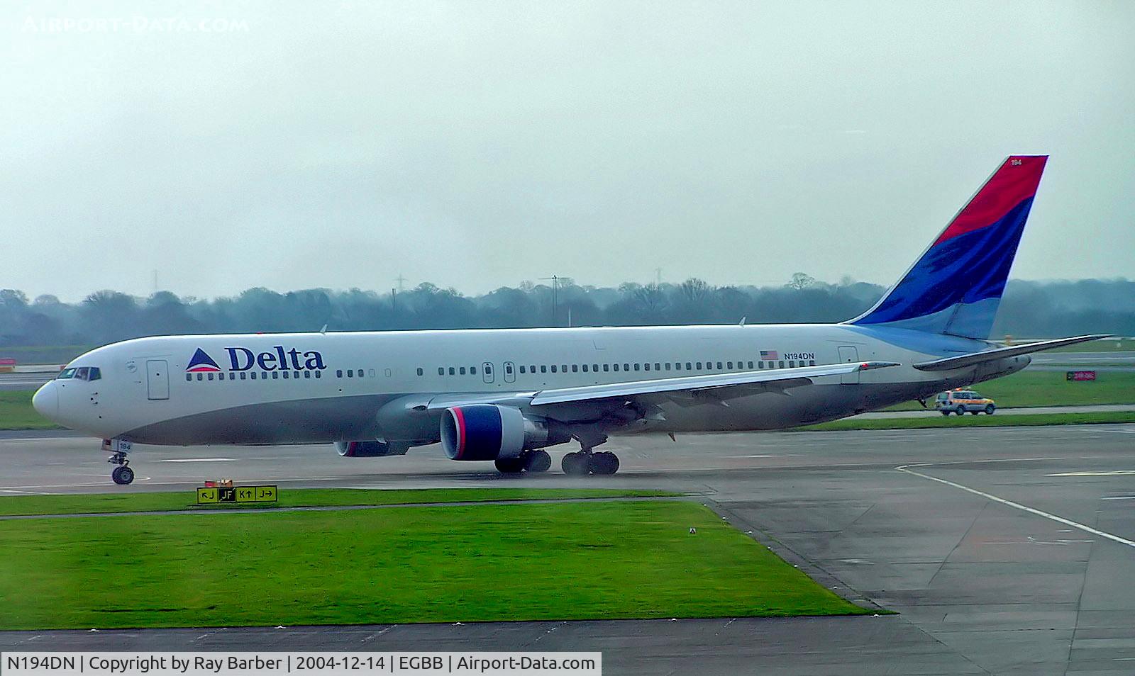N194DN, 1997 Boeing 767-332 C/N 28451, Boeing 767-332ER [28451] (Delta Air Lines) Manchester-Ringway~G 14/12/2004 Former colour scheme. Has a slight bit of backlight from the terminal window.
