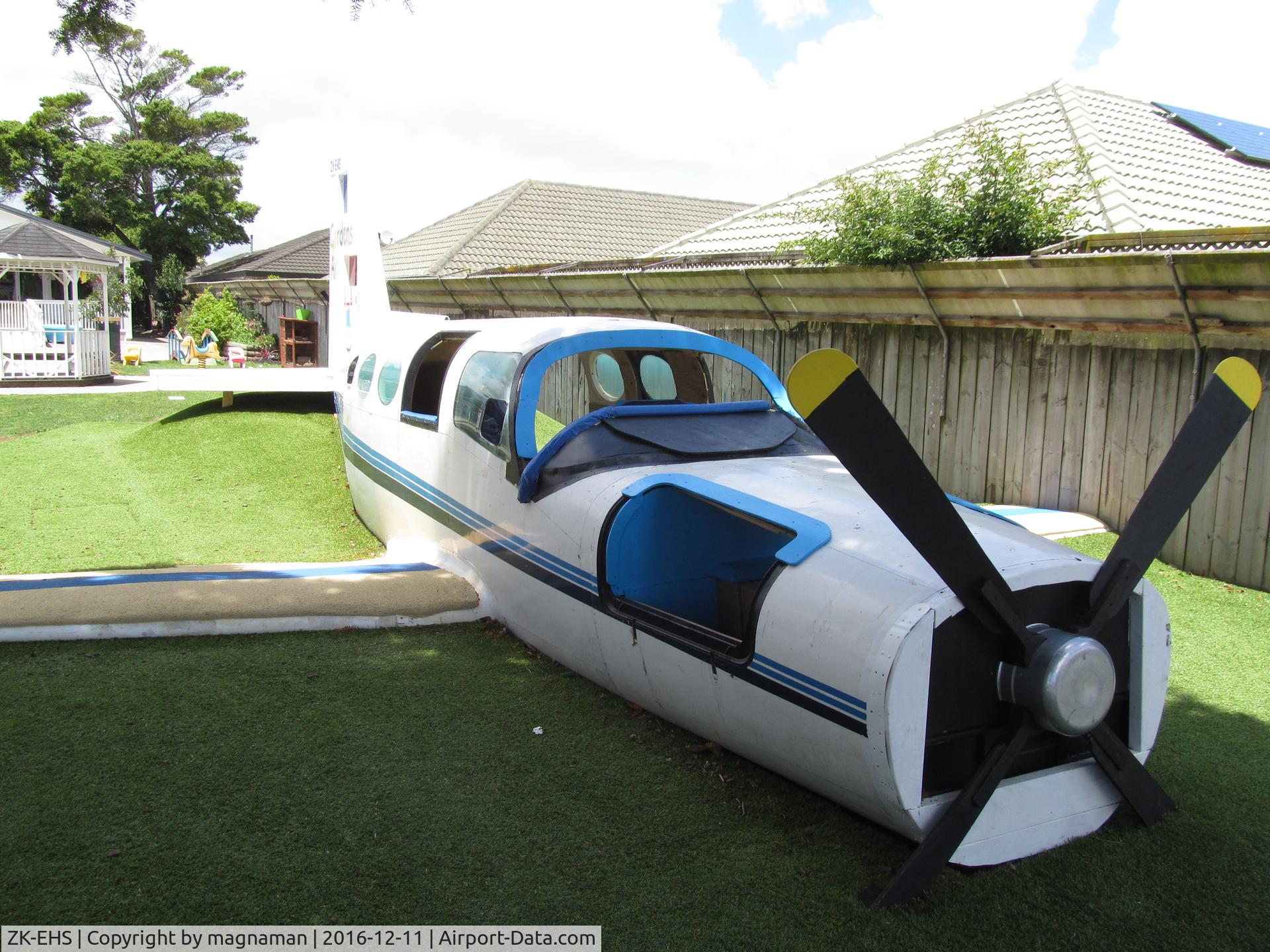 ZK-EHS, Cessna 402B C/N 402B0217, original fuselage - rest a play thing.
 
In childhood centre garden in south auckland