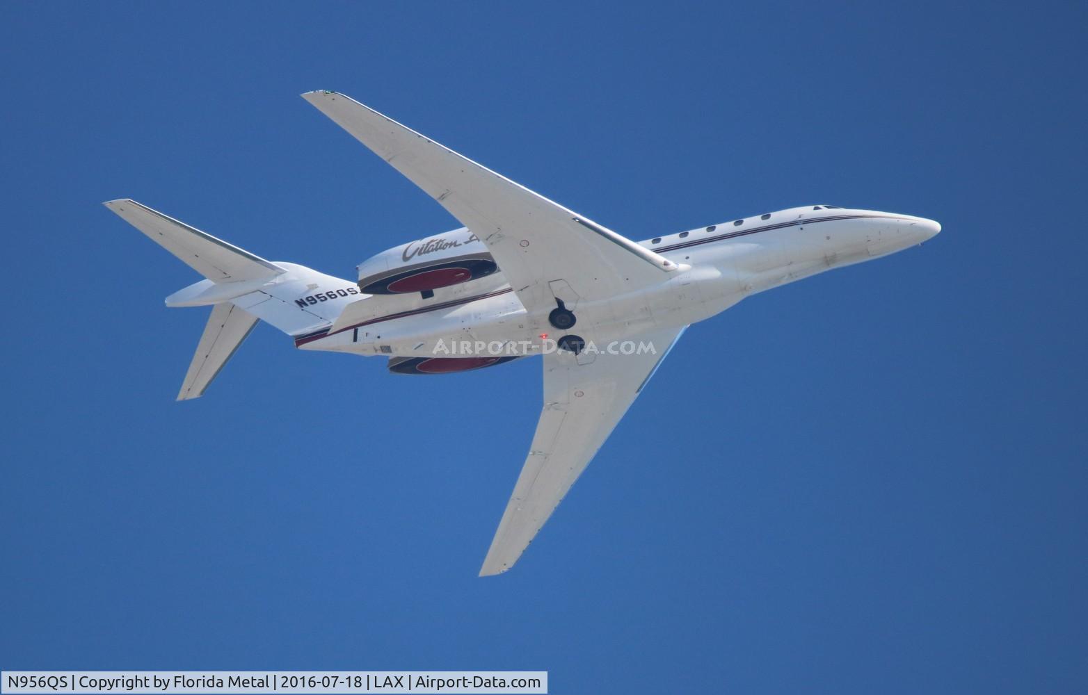N956QS, 2001 Cessna 750 Citation X Citation X C/N 750-0156, Net Jets departing over the beach