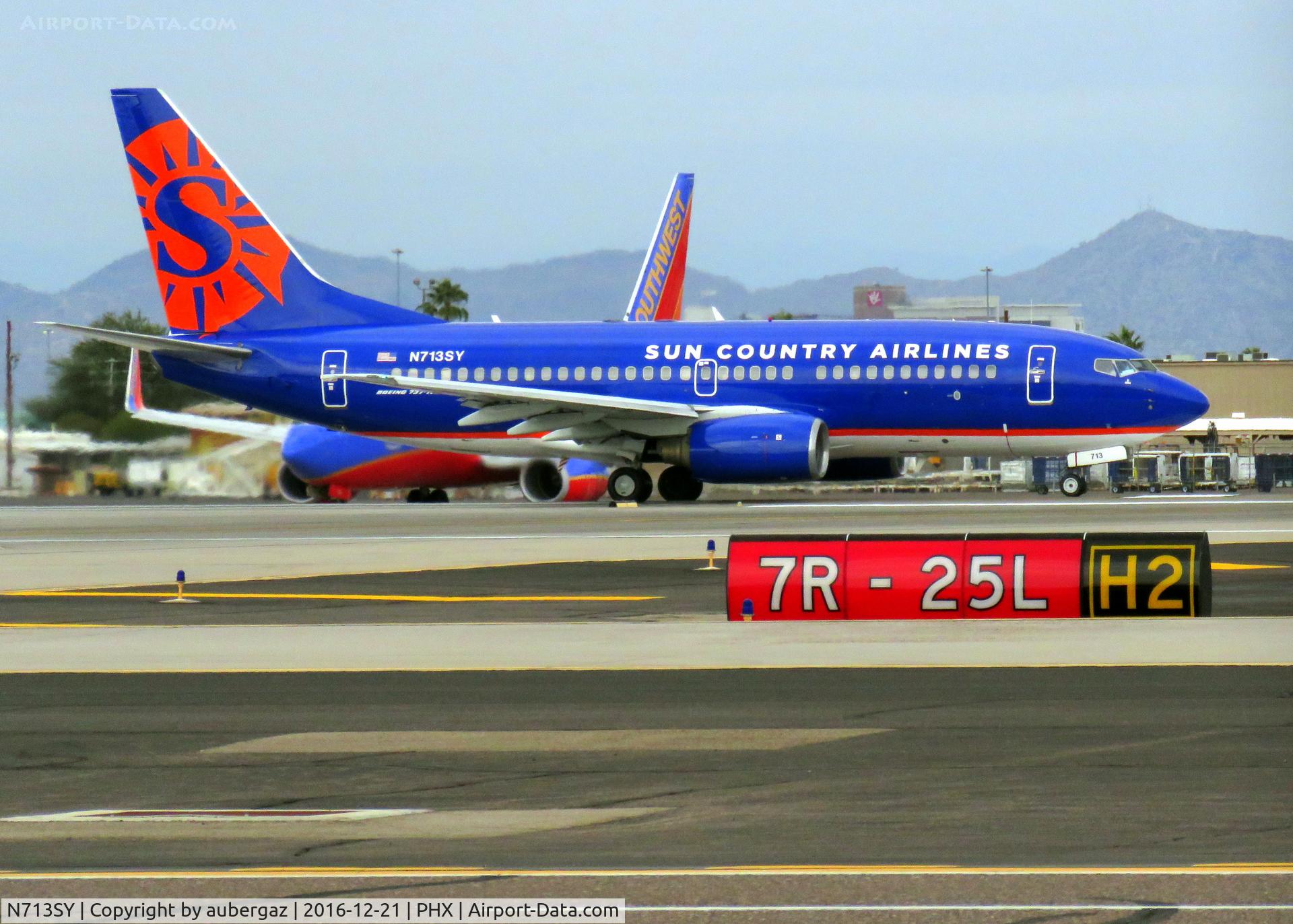 N713SY, 2000 Boeing 737-7Q8 C/N 30635, Taking off from PHX 7L.  New 'Sun Country' graphic.