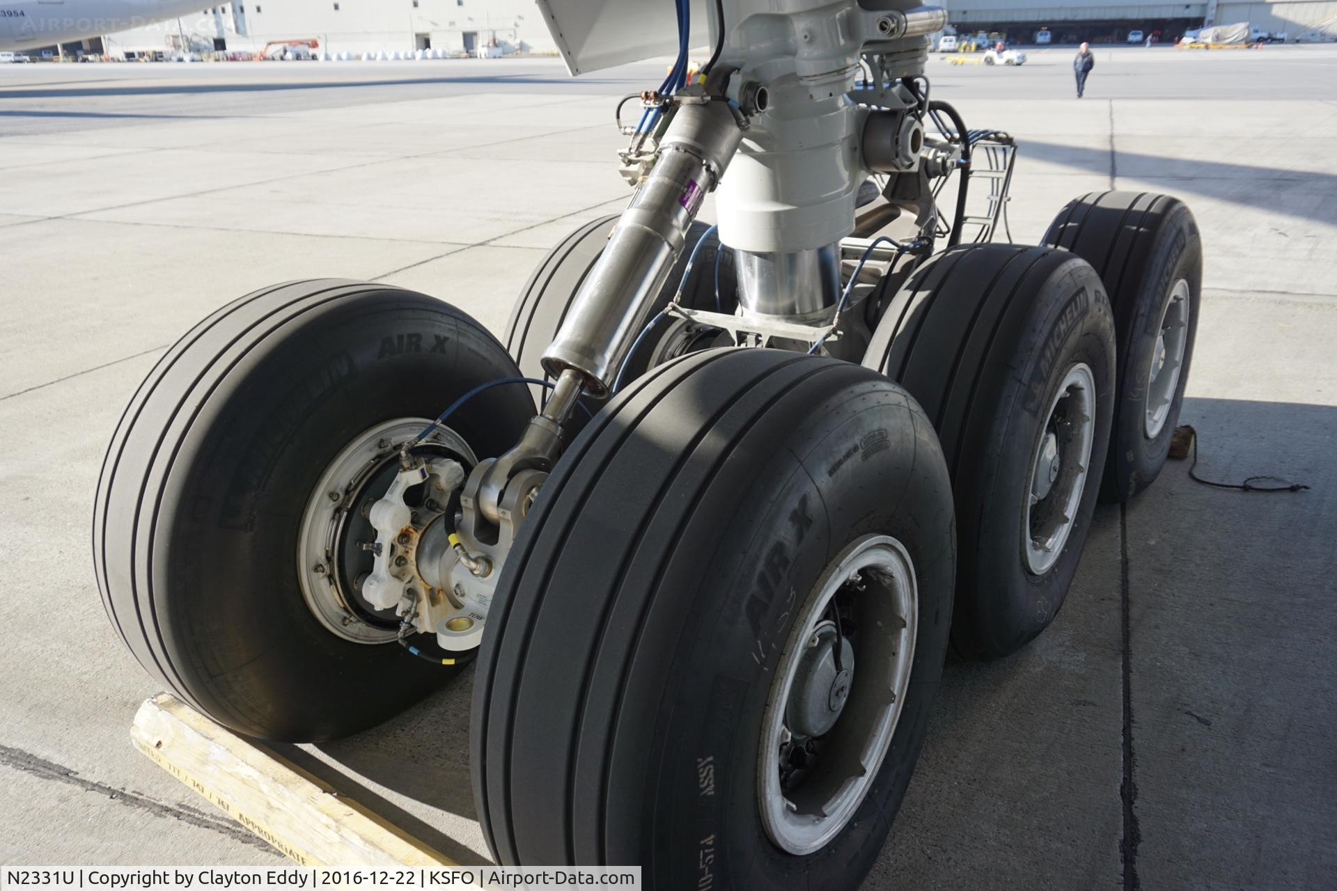 N2331U, 2016 Boeing 777-322/ER C/N 62642, Newly designed main landing gear. SFO 2016.
