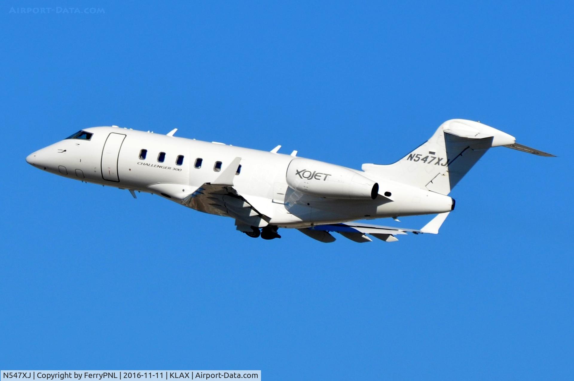 N547XJ, 2009 Bombardier Challenger 300 (BD-100-1A10) C/N 20281, Xojet CL300 climbing-out.